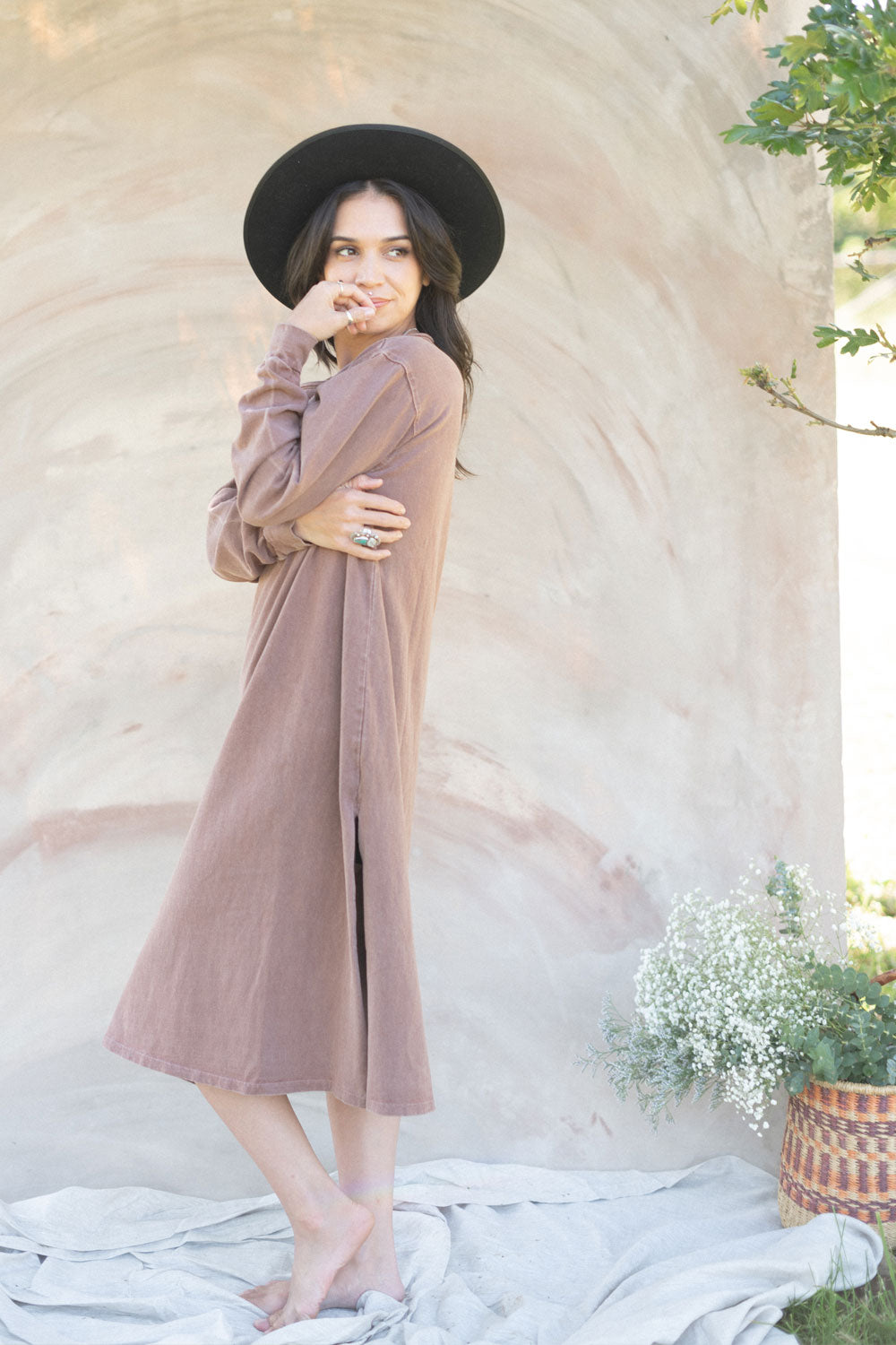 The Taylor Dress in four colors: Brown, Denim, Washed Black, and Peach, featuring long sleeves, a crew neck, and a slight hem slit.