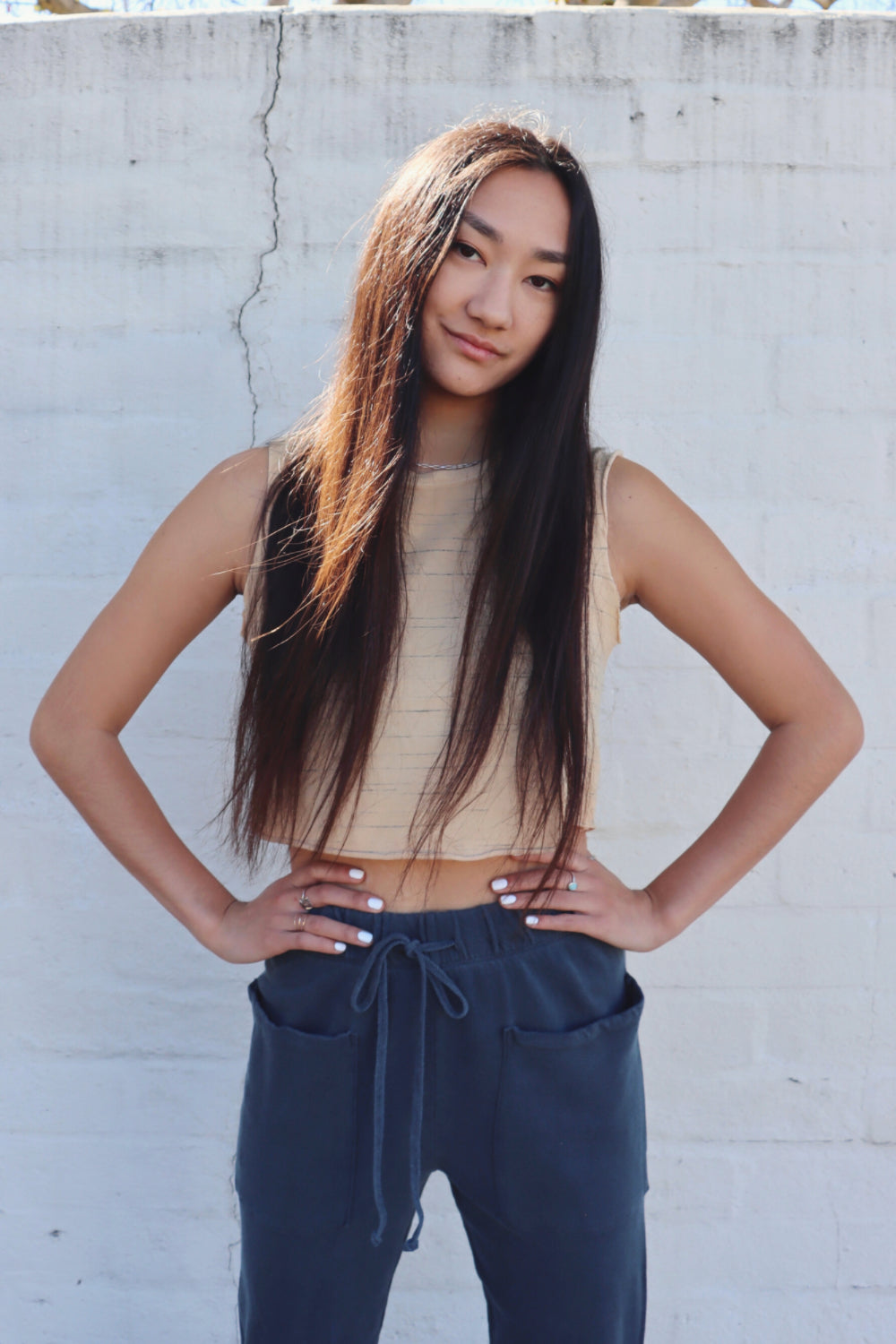 Person with long hair posing.