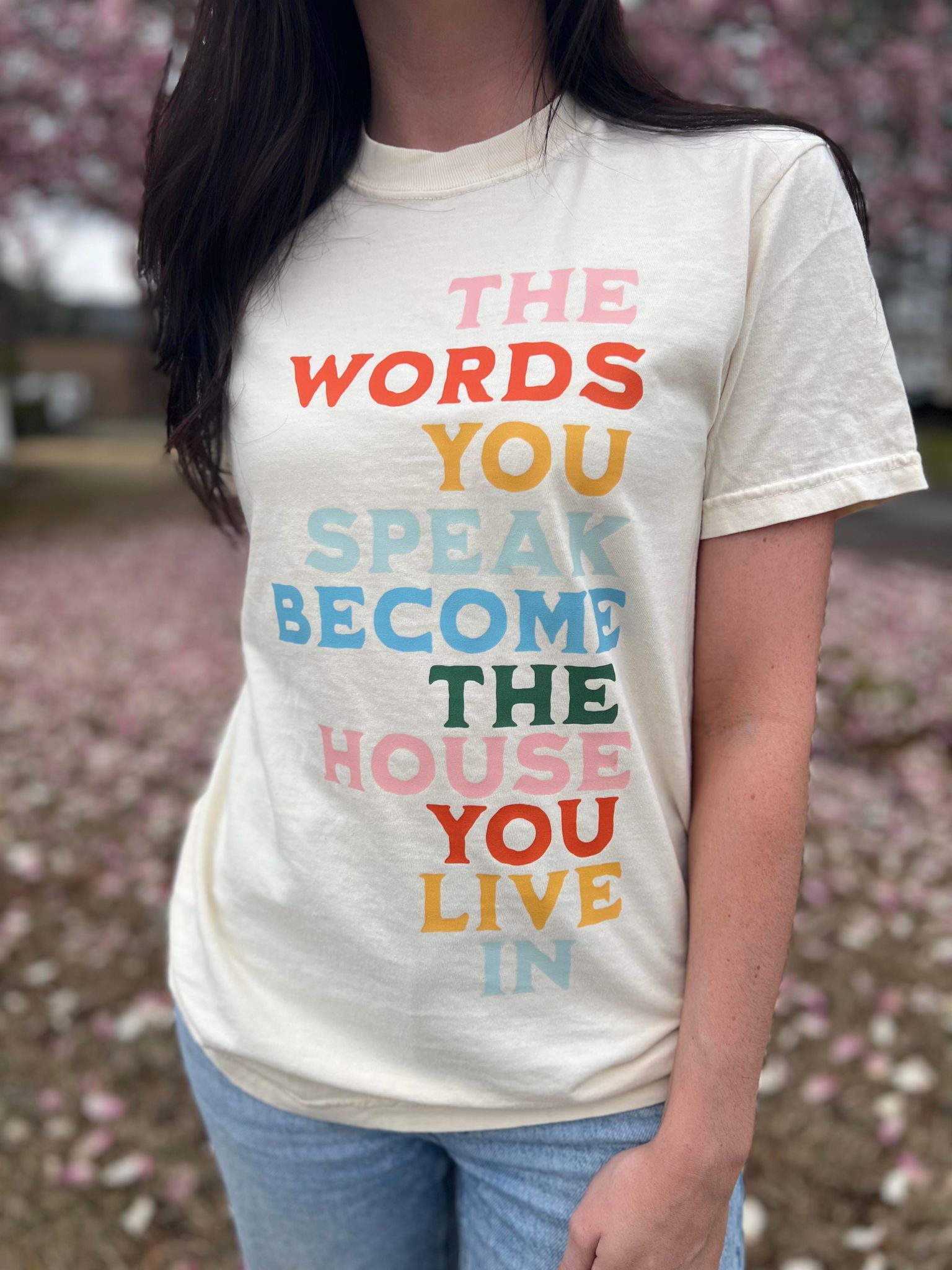 The Words You Speak Tee in ivory color, showcasing a vibrant design that promotes positivity and comfort.