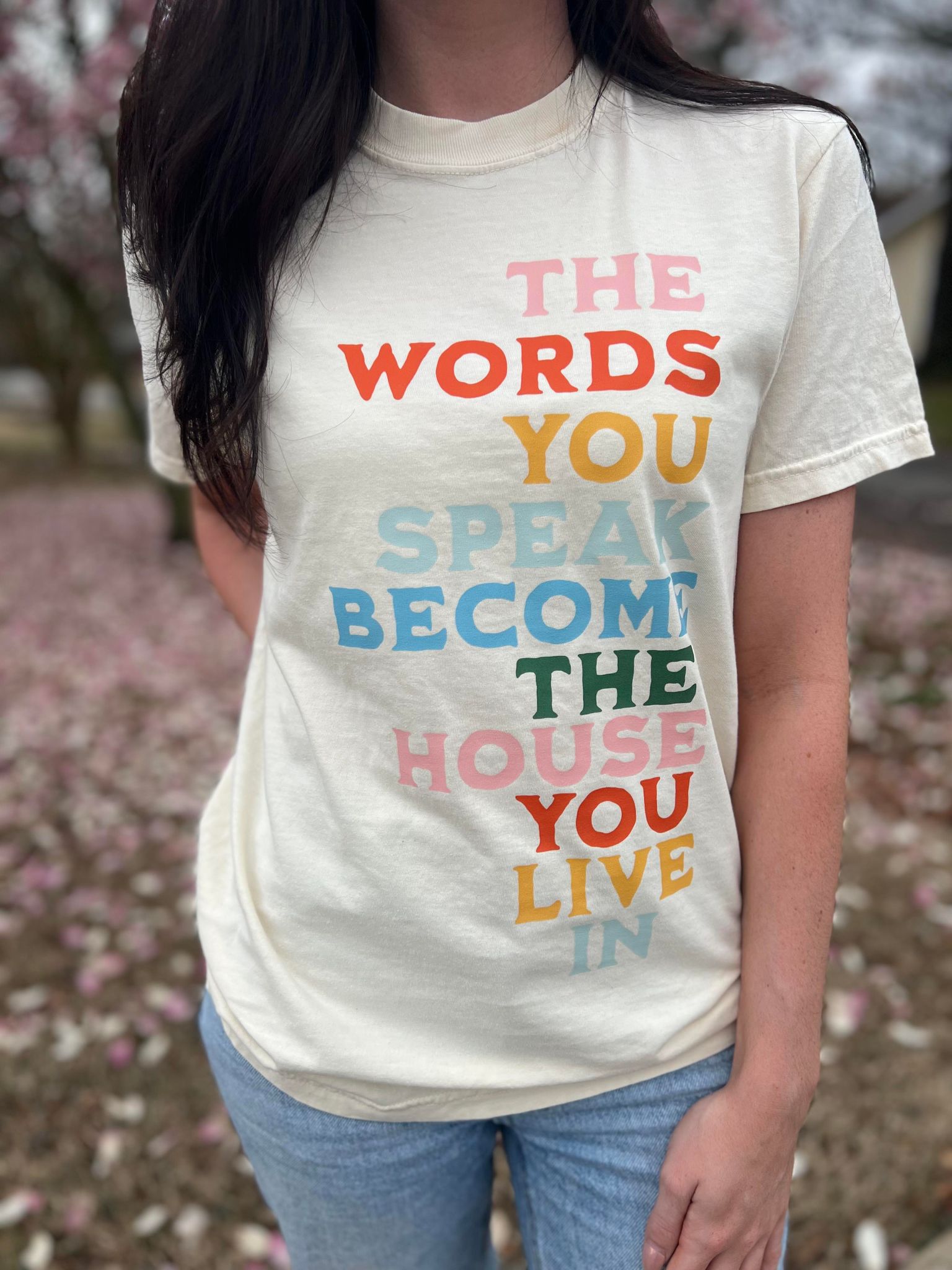 The Words You Speak Tee in ivory color, showcasing a vibrant design that promotes positivity and comfort.