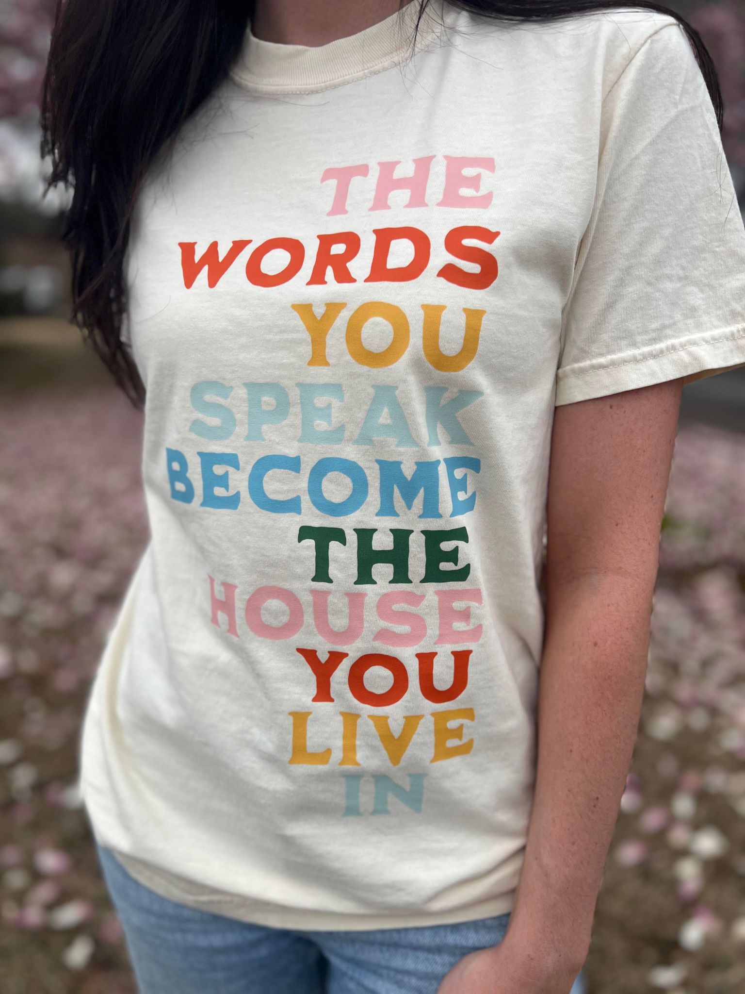 The Words You Speak Tee in ivory color, showcasing a vibrant design that promotes positivity and comfort.