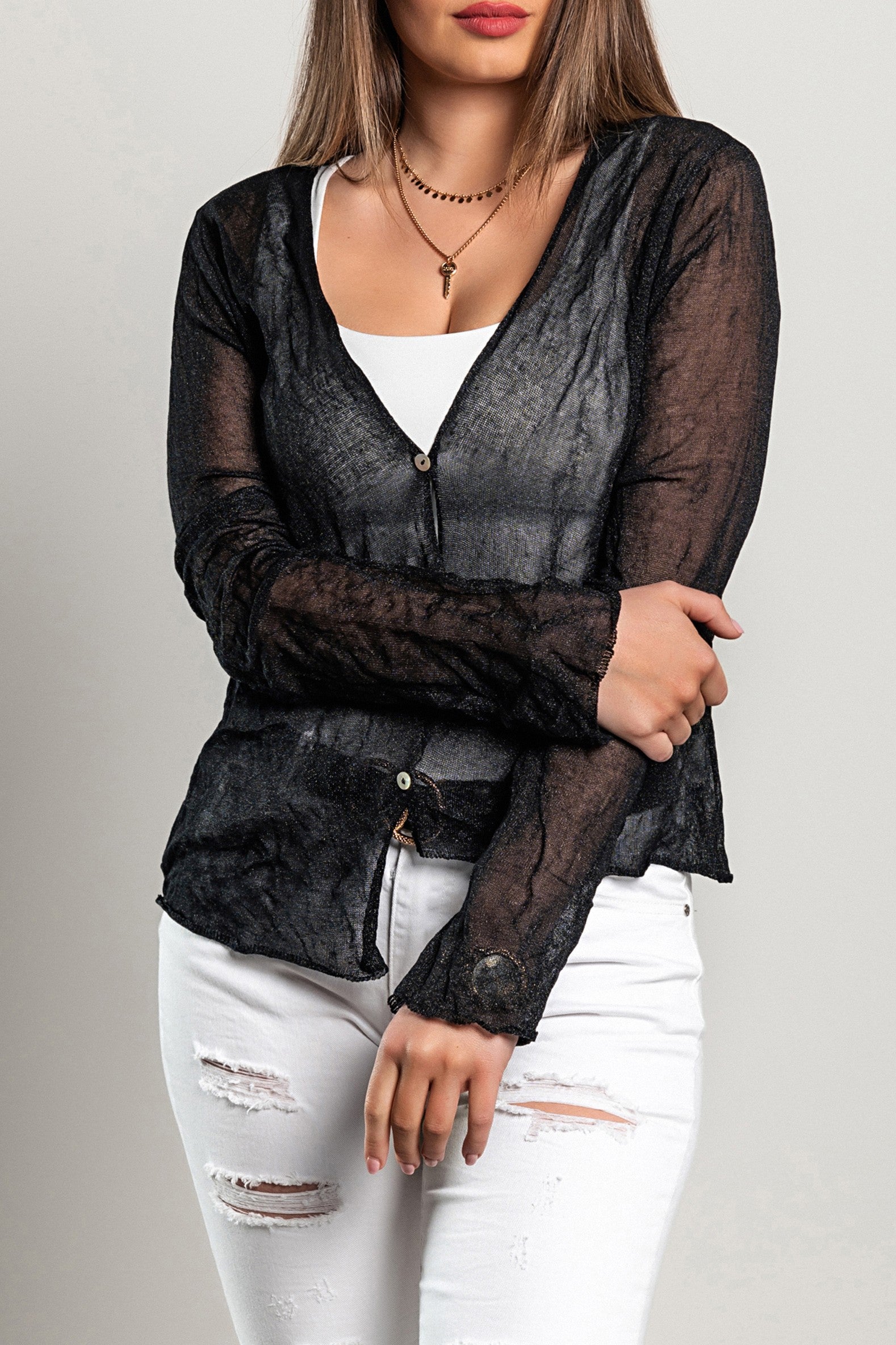 A stylish black thin cardigan with buttons, featuring an asymmetrical cut and long sleeves, perfect for layering.