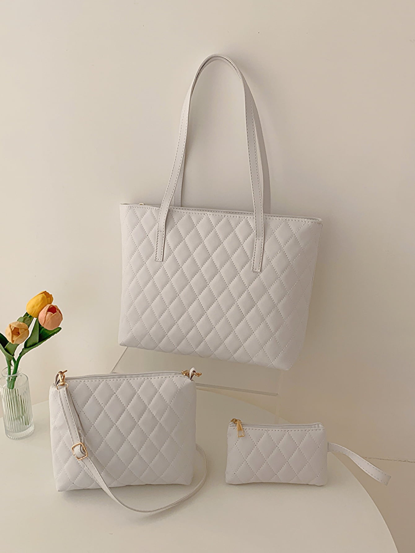 Three-piece vegan leather bag set featuring a medium handbag and two smaller bags in solid pattern, showcasing high-quality PU leather.