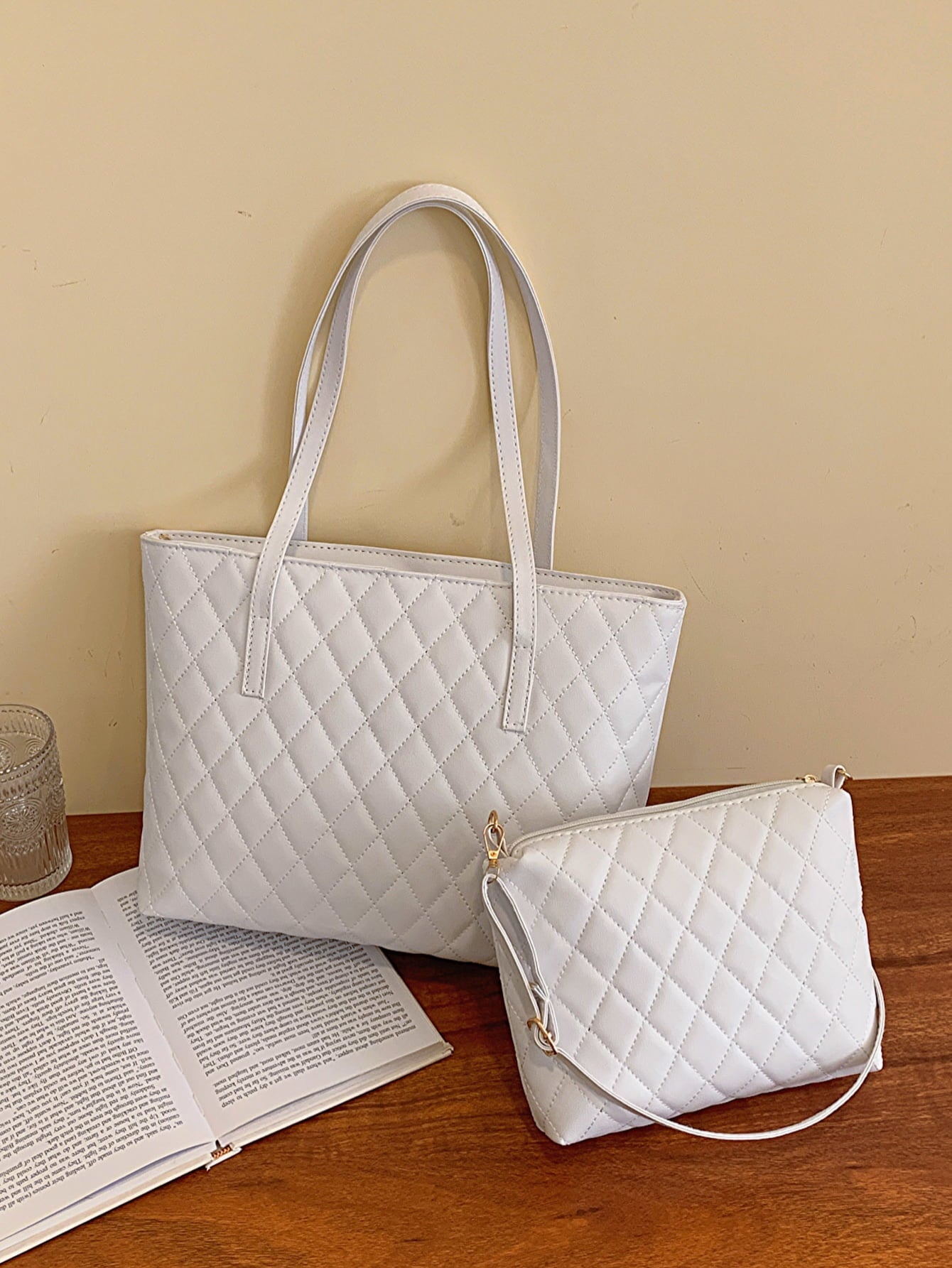 Three-piece vegan leather bag set featuring a medium handbag and two smaller bags in solid pattern, showcasing high-quality PU leather.