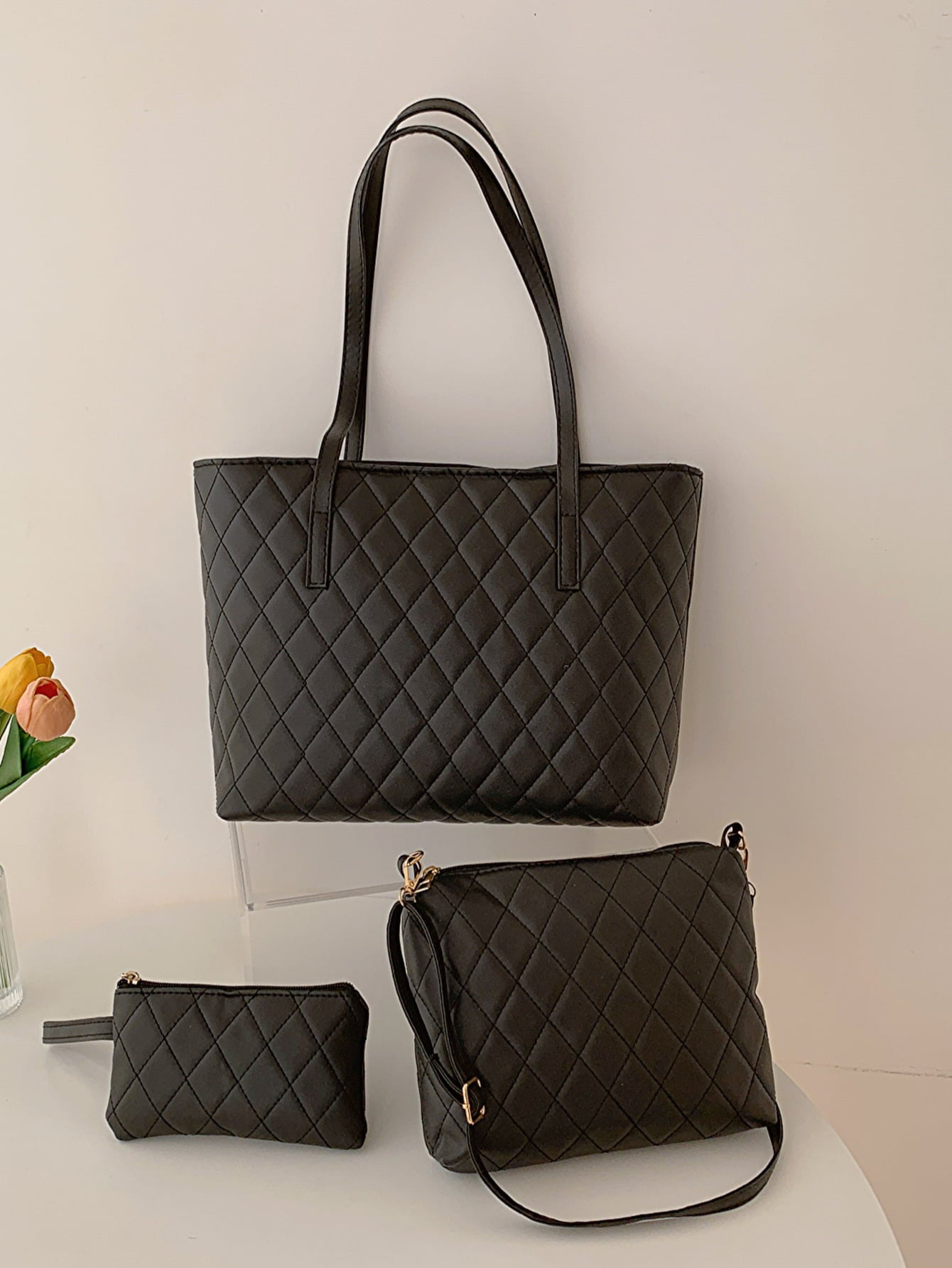 Three-piece vegan leather bag set featuring a medium handbag and two smaller bags in solid pattern, showcasing high-quality PU leather.