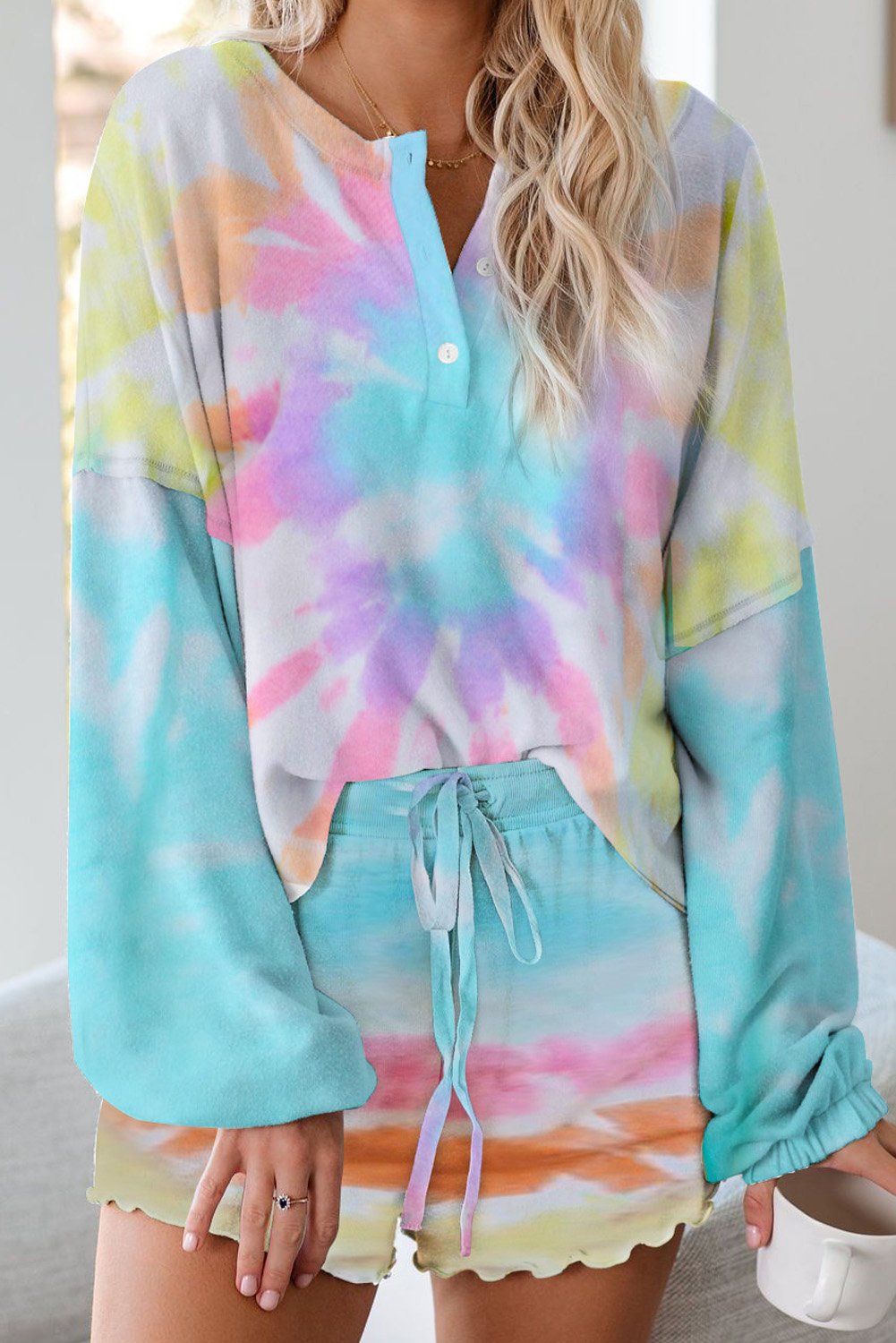 A stylish Tie Dye Knit Pajamas Set featuring a long sleeve pullover and shorts with a chic tie dye pattern, perfect for cozy lounging.