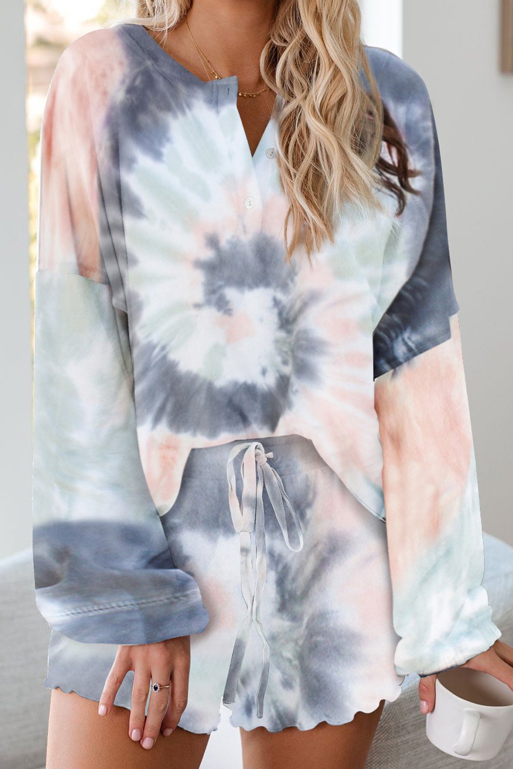 A stylish Tie Dye Knit Pajamas Set featuring a long sleeve pullover and shorts with a chic tie dye pattern, perfect for cozy lounging.