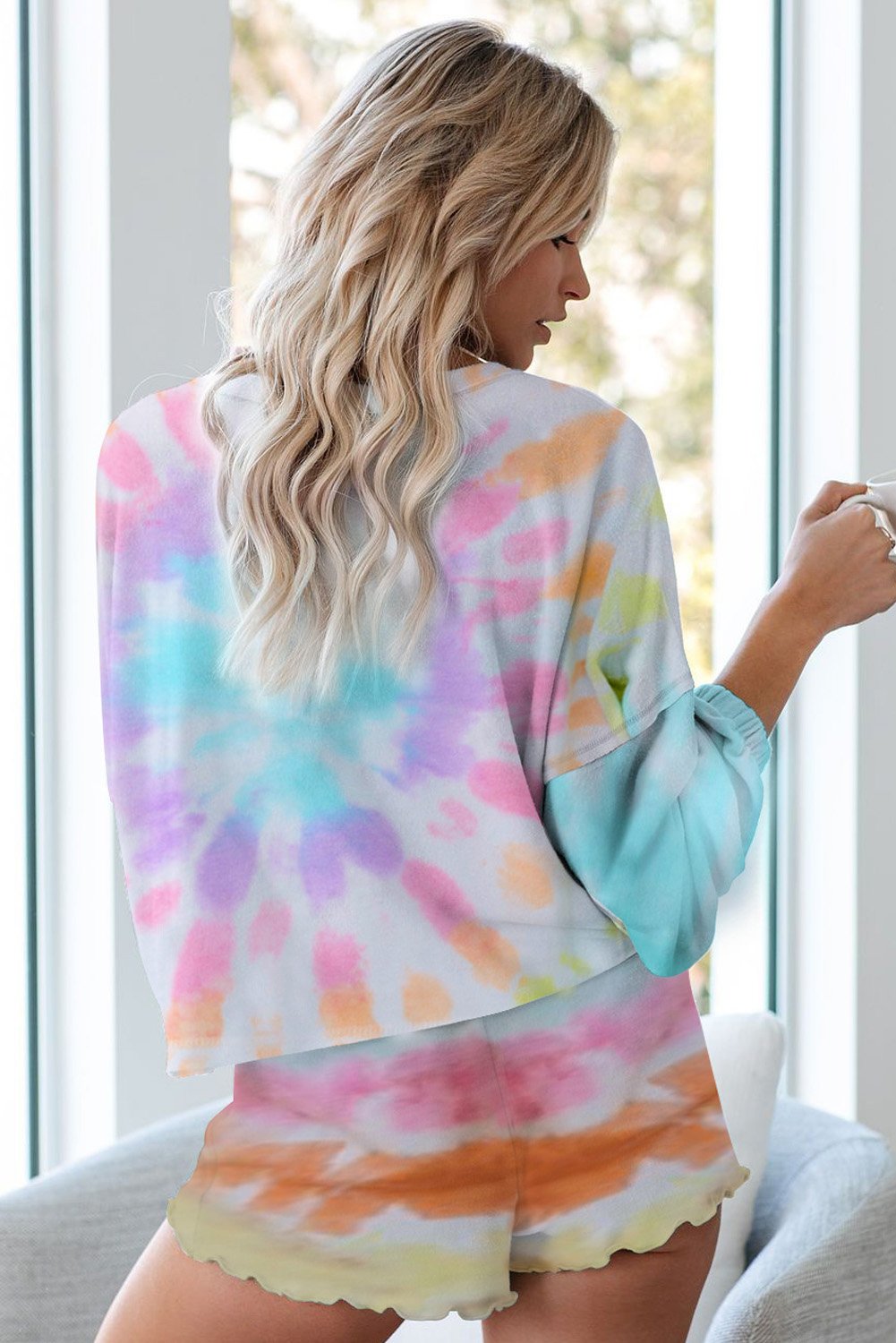 A stylish Tie Dye Knit Pajamas Set featuring a long sleeve pullover and shorts with a chic tie dye pattern, perfect for cozy lounging.