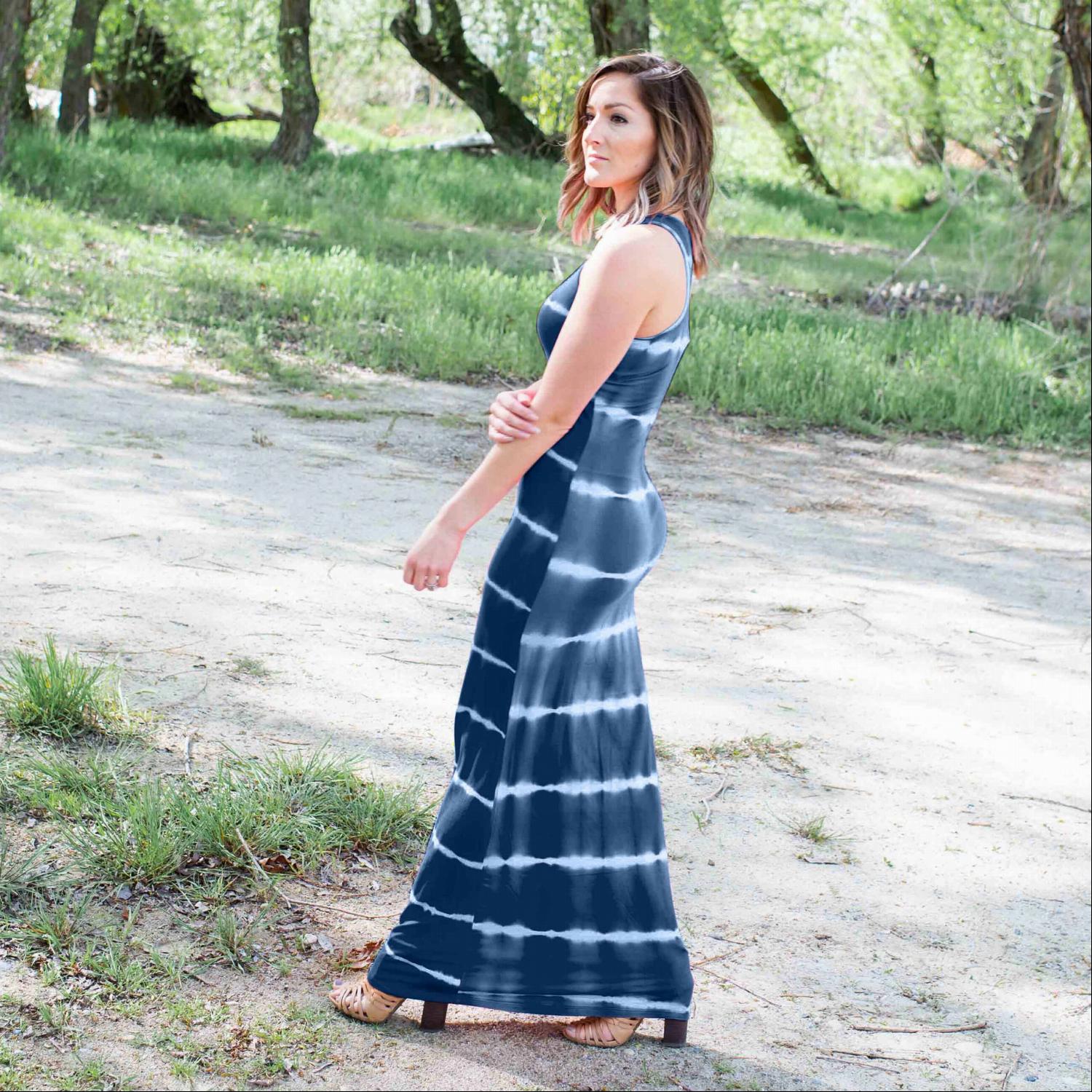 A vibrant tie dye maxi dress featuring ocean-inspired colors, sleeveless design, and a flowing silhouette, perfect for summer outings.