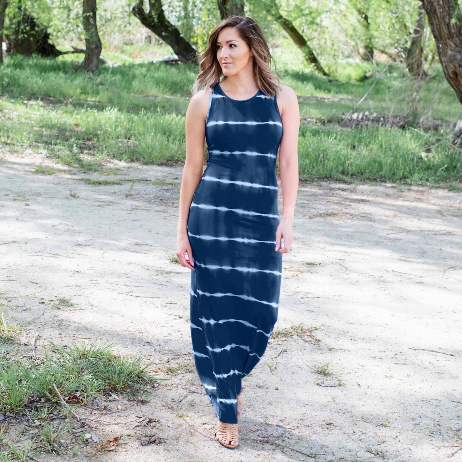 A vibrant tie dye maxi dress featuring ocean-inspired colors, sleeveless design, and a flowing silhouette, perfect for summer outings.