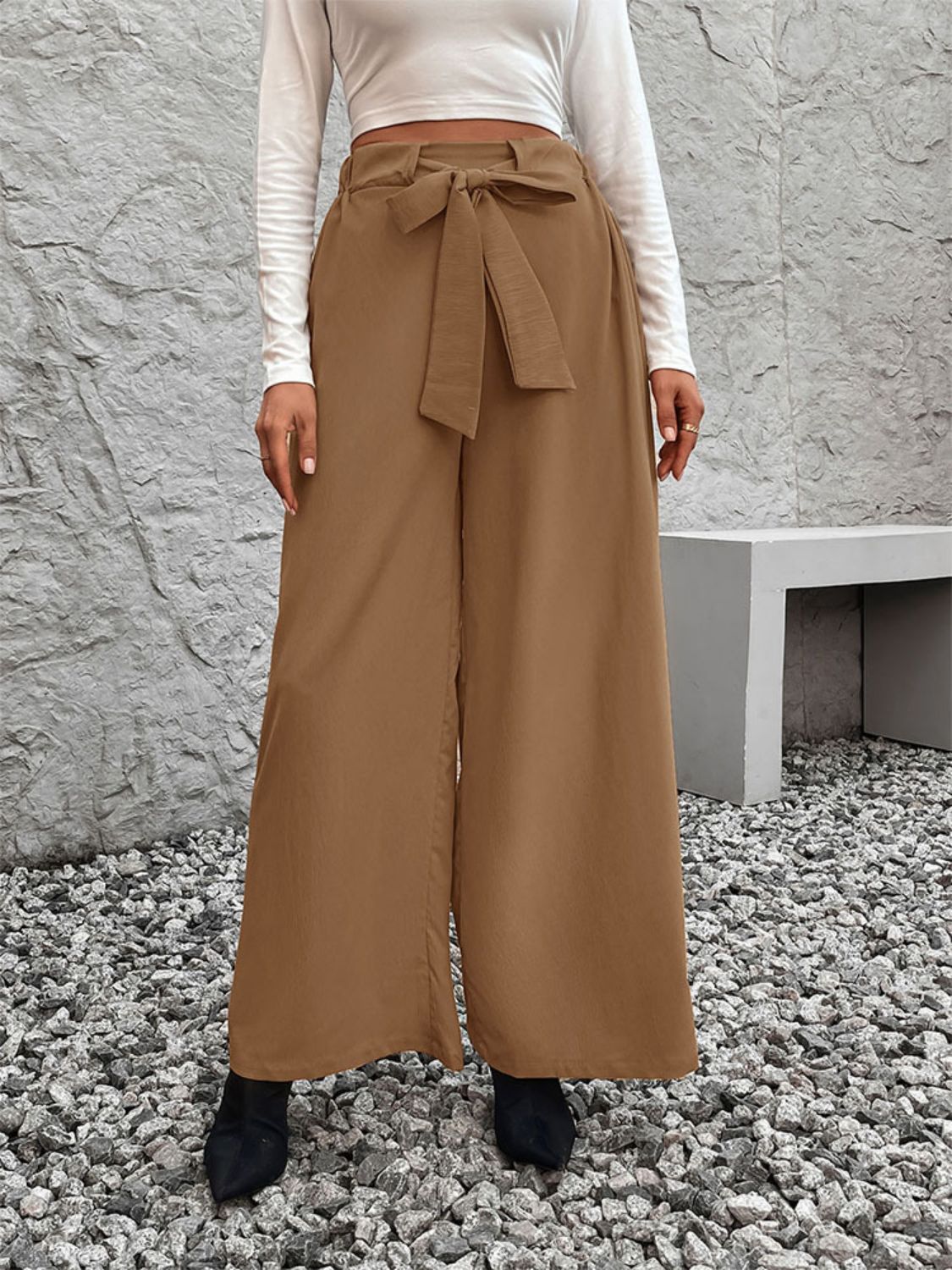 A pair of stylish Tied High Waist Wide Leg Pants in a chic design, showcasing the tied waist and wide leg silhouette.