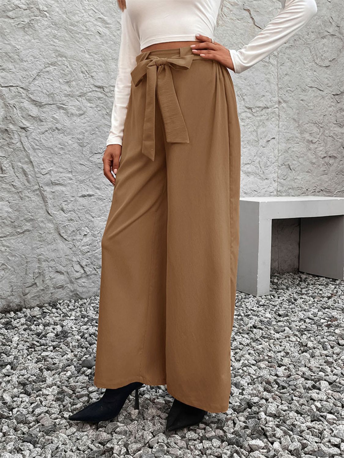 A pair of stylish Tied High Waist Wide Leg Pants in a chic design, showcasing the tied waist and wide leg silhouette.