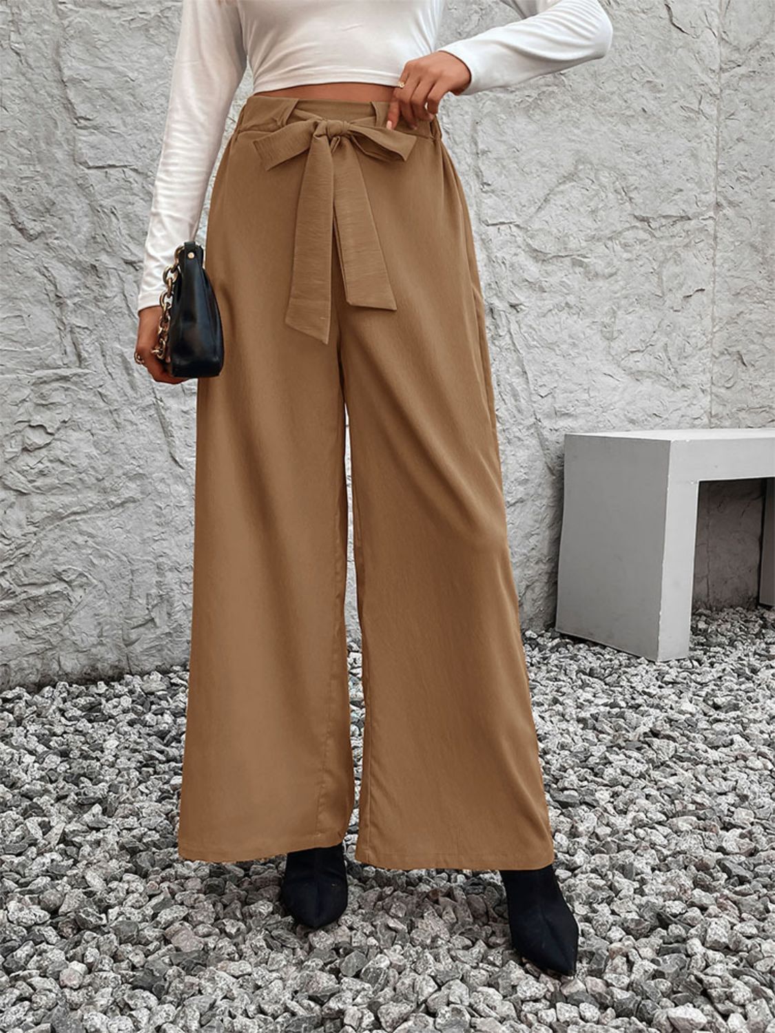 A pair of stylish Tied High Waist Wide Leg Pants in a chic design, showcasing the tied waist and wide leg silhouette.