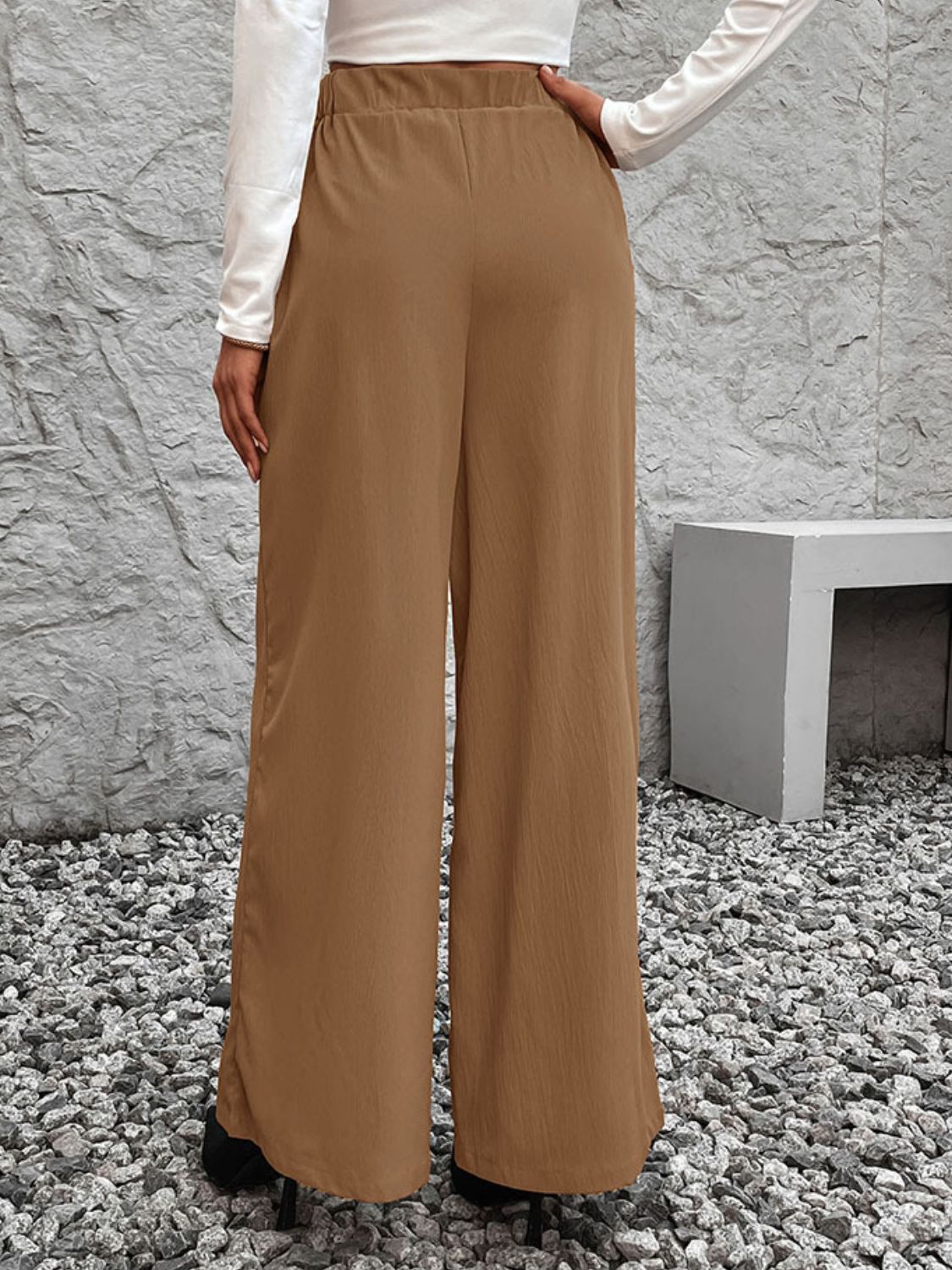 A pair of stylish Tied High Waist Wide Leg Pants in a chic design, showcasing the tied waist and wide leg silhouette.