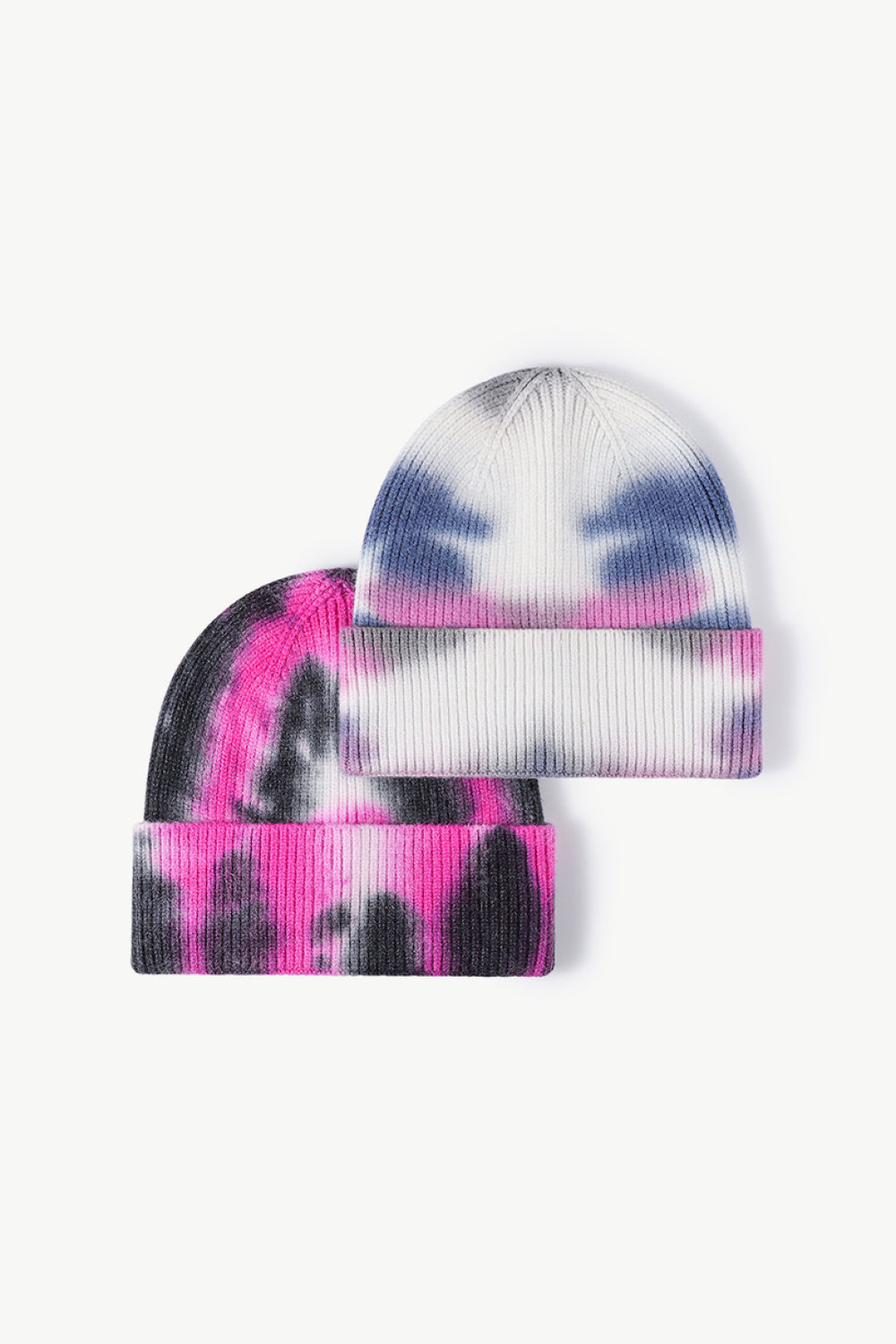 A colorful tie-dye cuffed knit beanie displayed in a flat lay style, showcasing its vibrant patterns and soft texture.