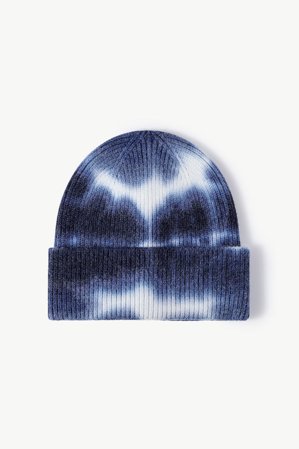 A colorful tie-dye cuffed knit beanie displayed in a flat lay style, showcasing its vibrant patterns and soft texture.