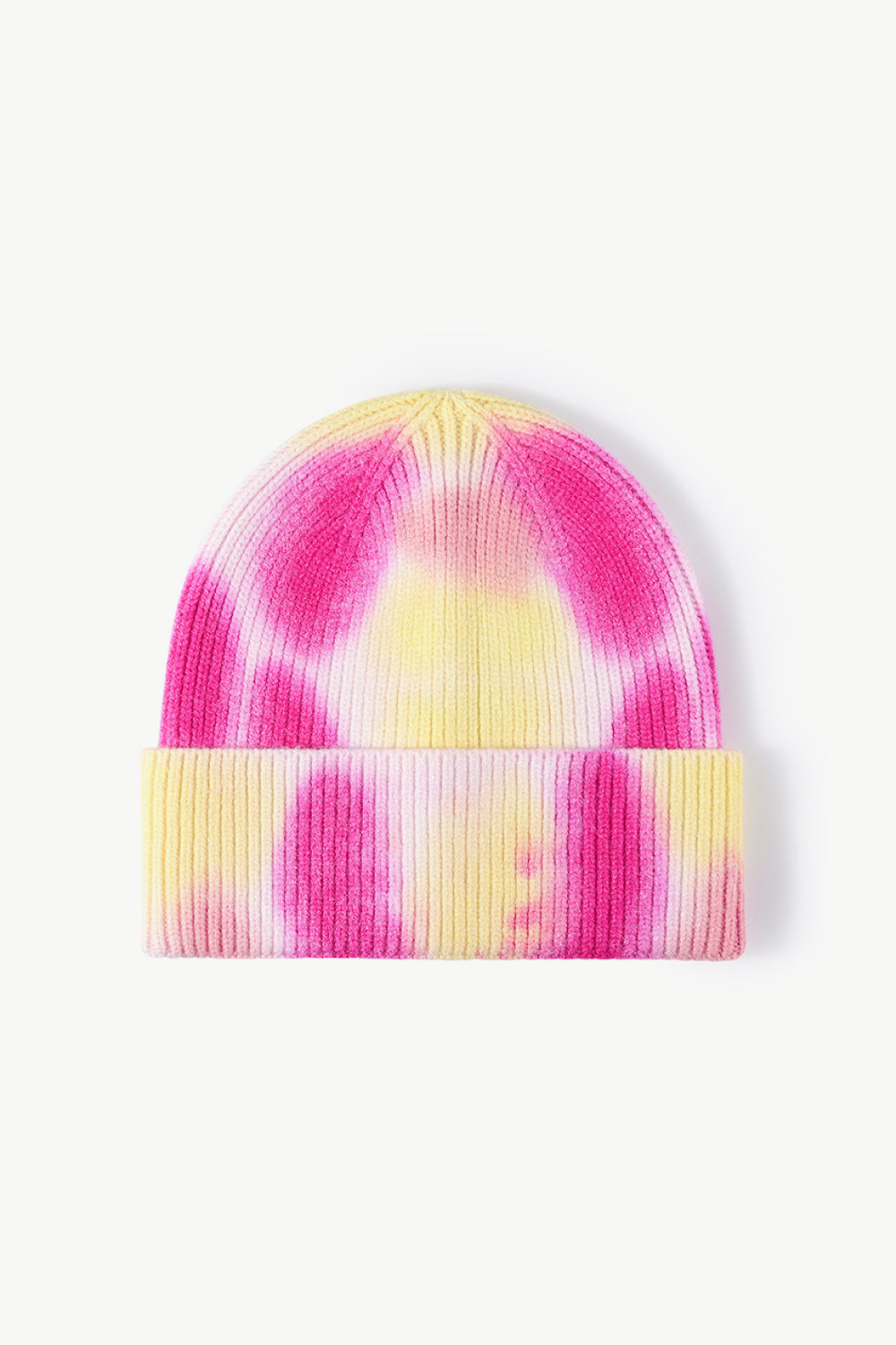 A colorful tie-dye cuffed knit beanie displayed in a flat lay style, showcasing its vibrant patterns and soft texture.