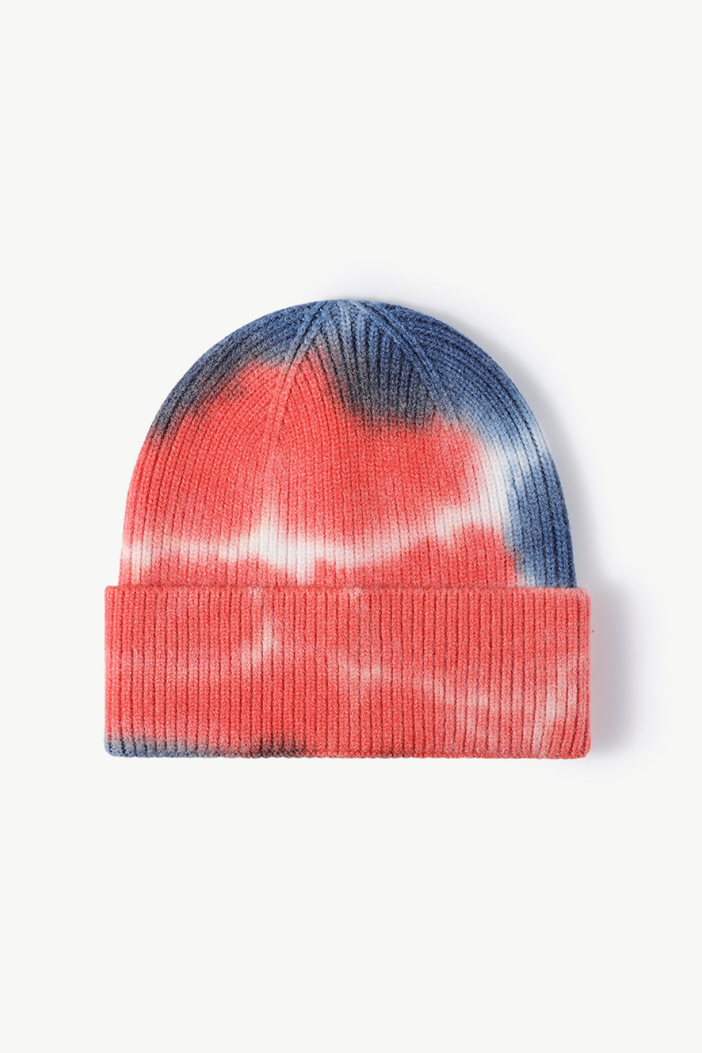 A colorful tie-dye cuffed knit beanie displayed in a flat lay style, showcasing its vibrant patterns and soft texture.