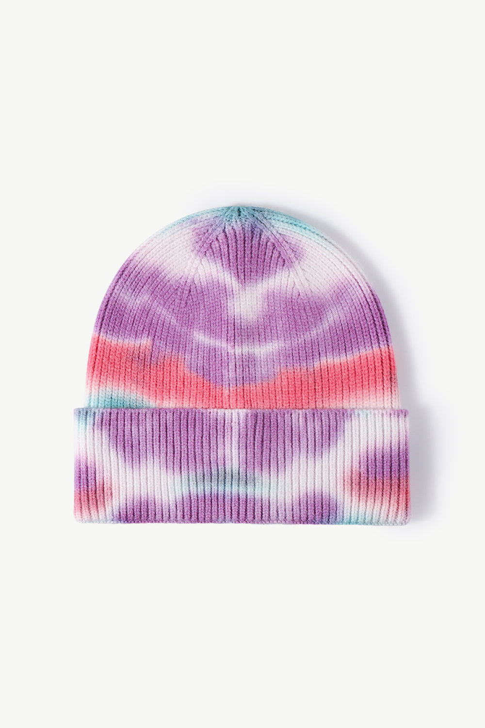 A colorful tie-dye cuffed knit beanie displayed in a flat lay style, showcasing its vibrant patterns and soft texture.