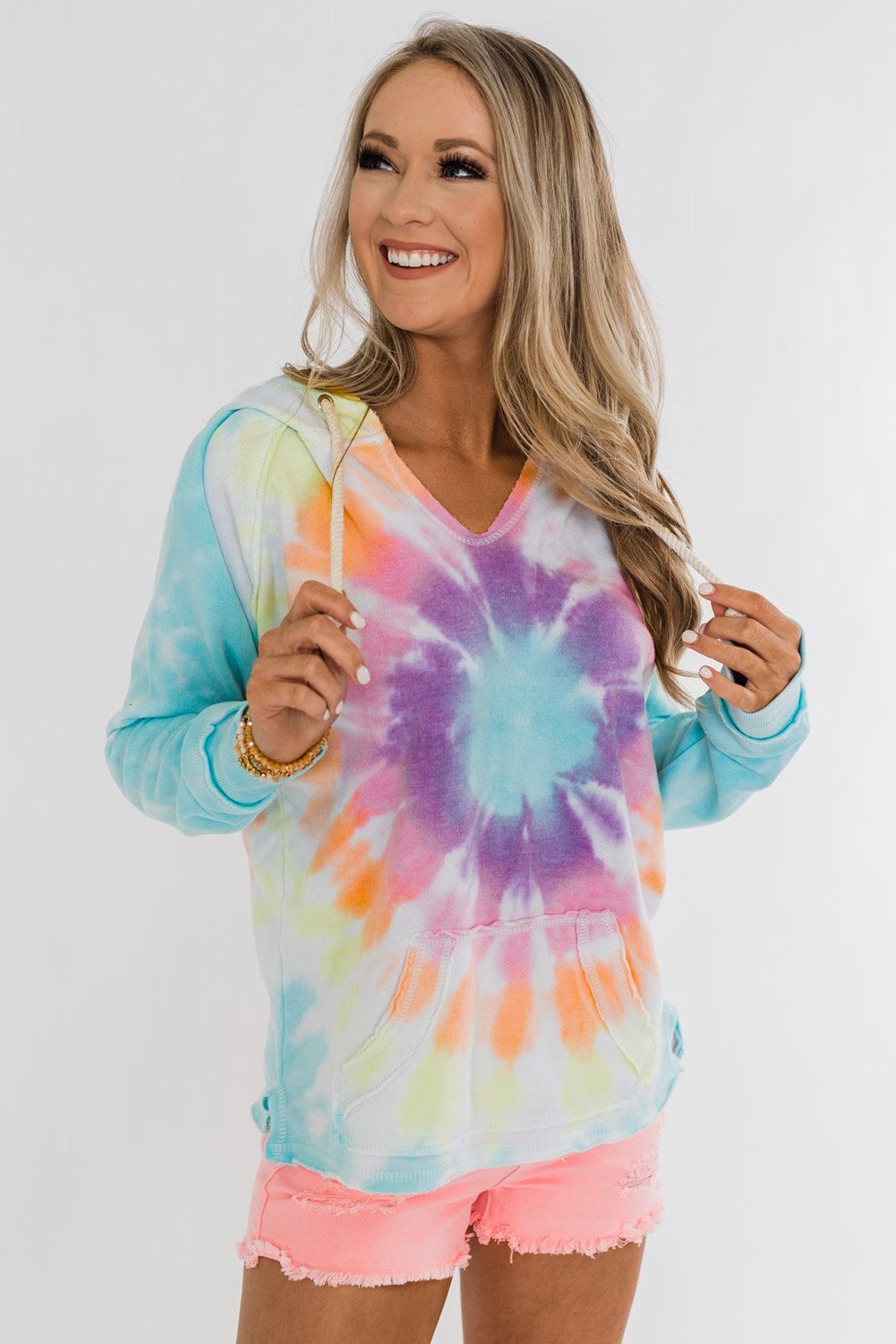 A stylish tie-dye pattern pullover hoodie with adjustable drawstring hood, showcasing vibrant colors and a comfortable fit.