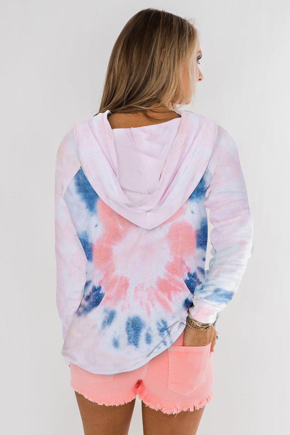 A stylish tie-dye pattern pullover hoodie with adjustable drawstring hood, showcasing vibrant colors and a comfortable fit.