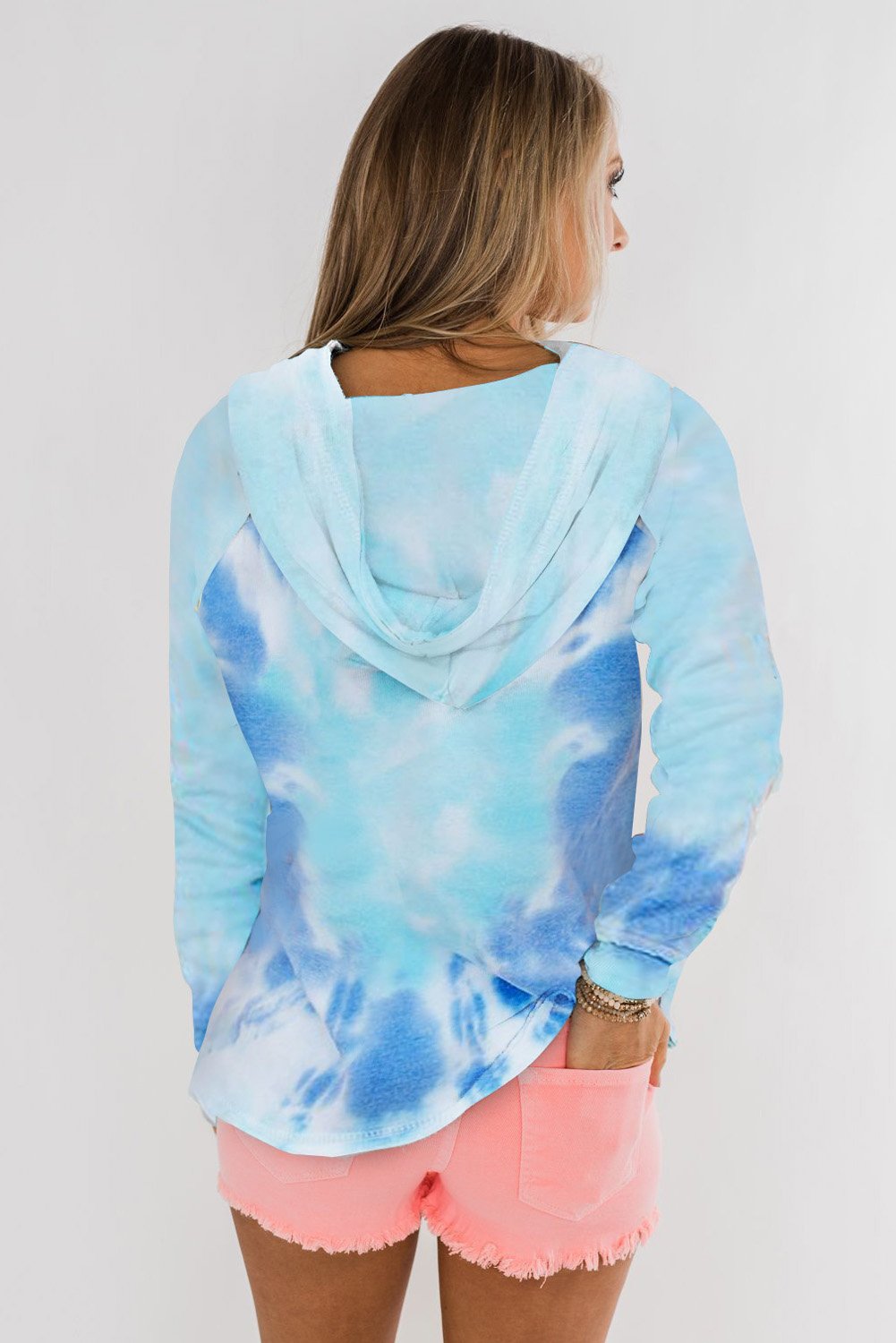 A stylish tie-dye pattern pullover hoodie with adjustable drawstring hood, showcasing vibrant colors and a comfortable fit.