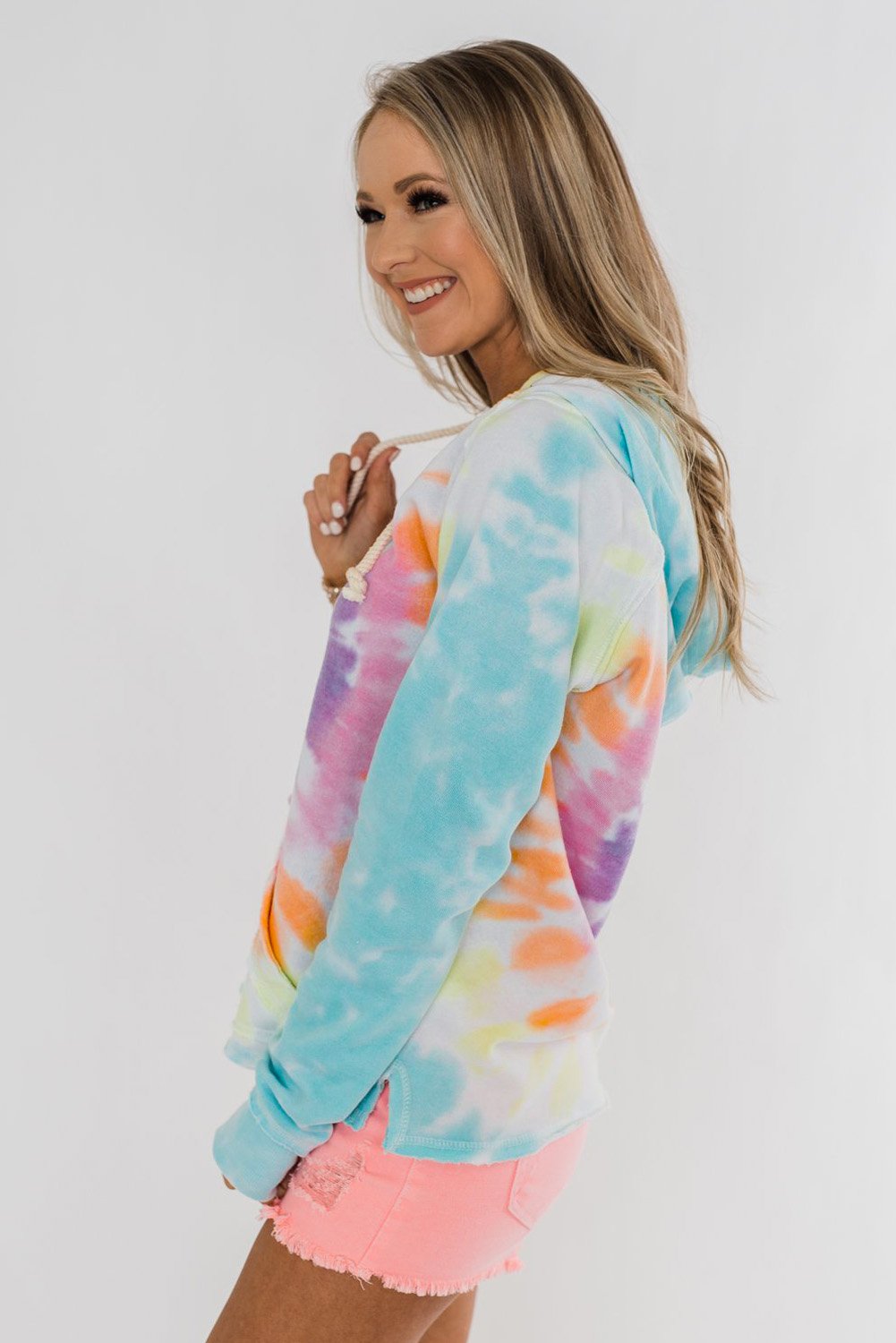 A stylish tie-dye pattern pullover hoodie with adjustable drawstring hood, showcasing vibrant colors and a comfortable fit.