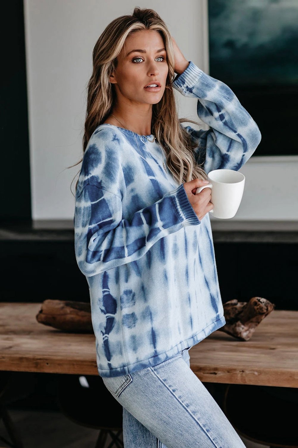 A cozy tie-dye print knit sweater featuring a relaxed fit, perfect for all body types, showcasing vibrant colors and chunky knit fabric.