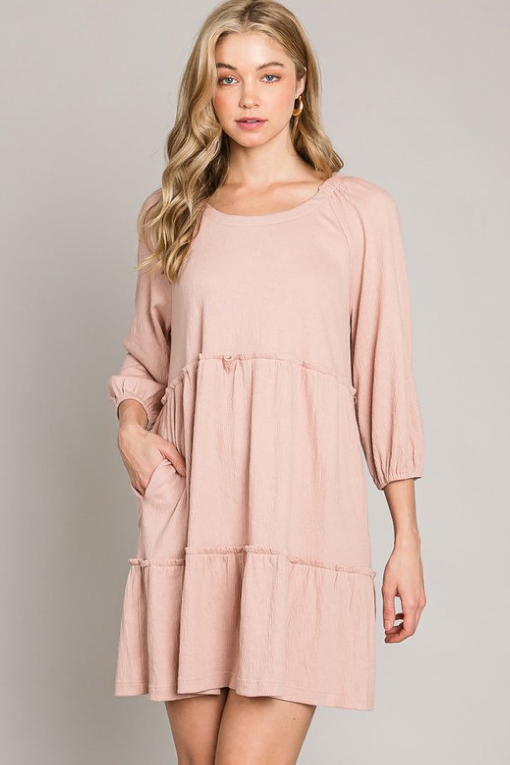 A stylish Tiered Tie-Back Dress featuring three-quarter sleeves, a low-back tie detail, and a tiered A-line design, perfect for casual or date night.