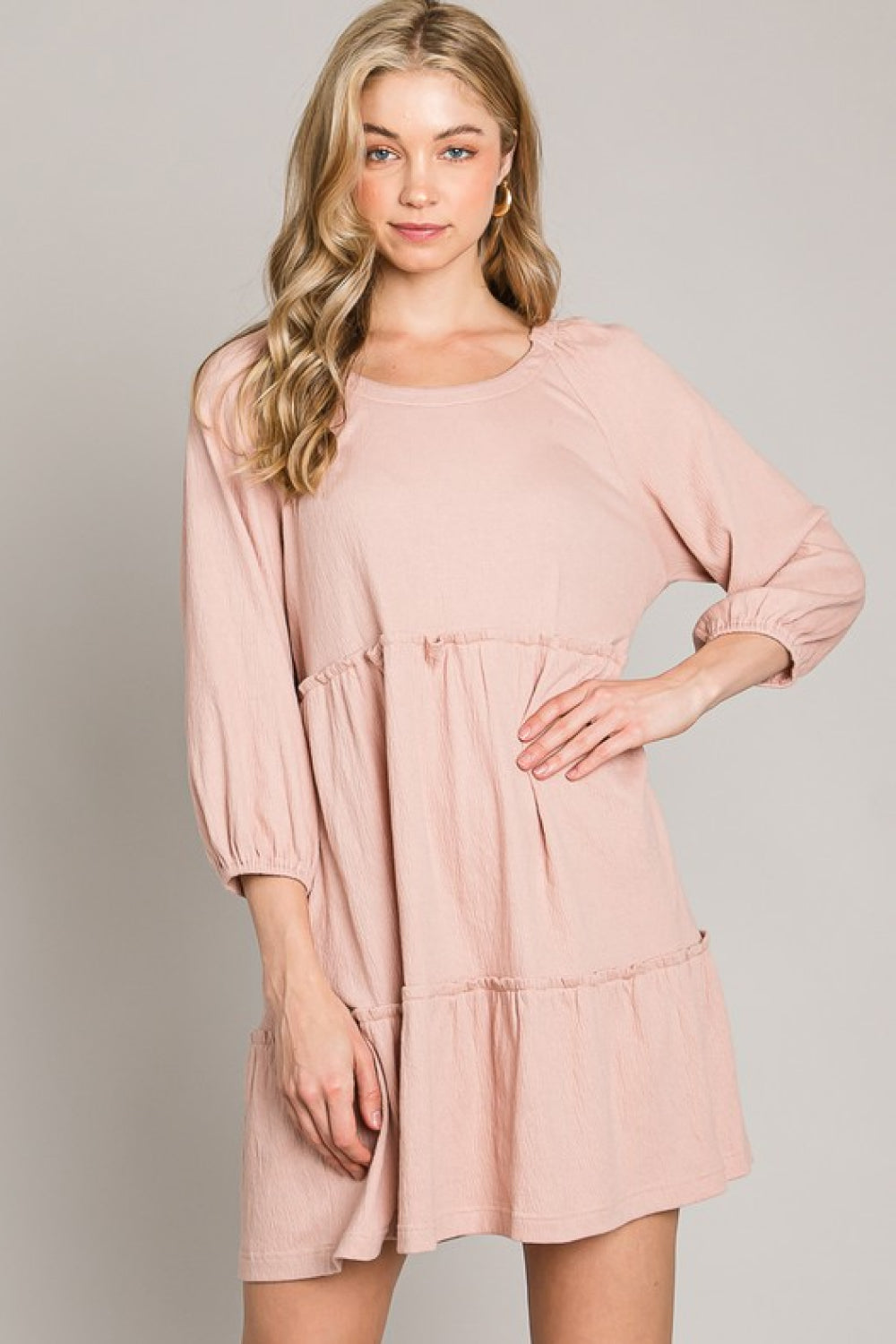 A stylish Tiered Tie-Back Dress featuring three-quarter sleeves, a low-back tie detail, and a tiered A-line design, perfect for casual or date night.