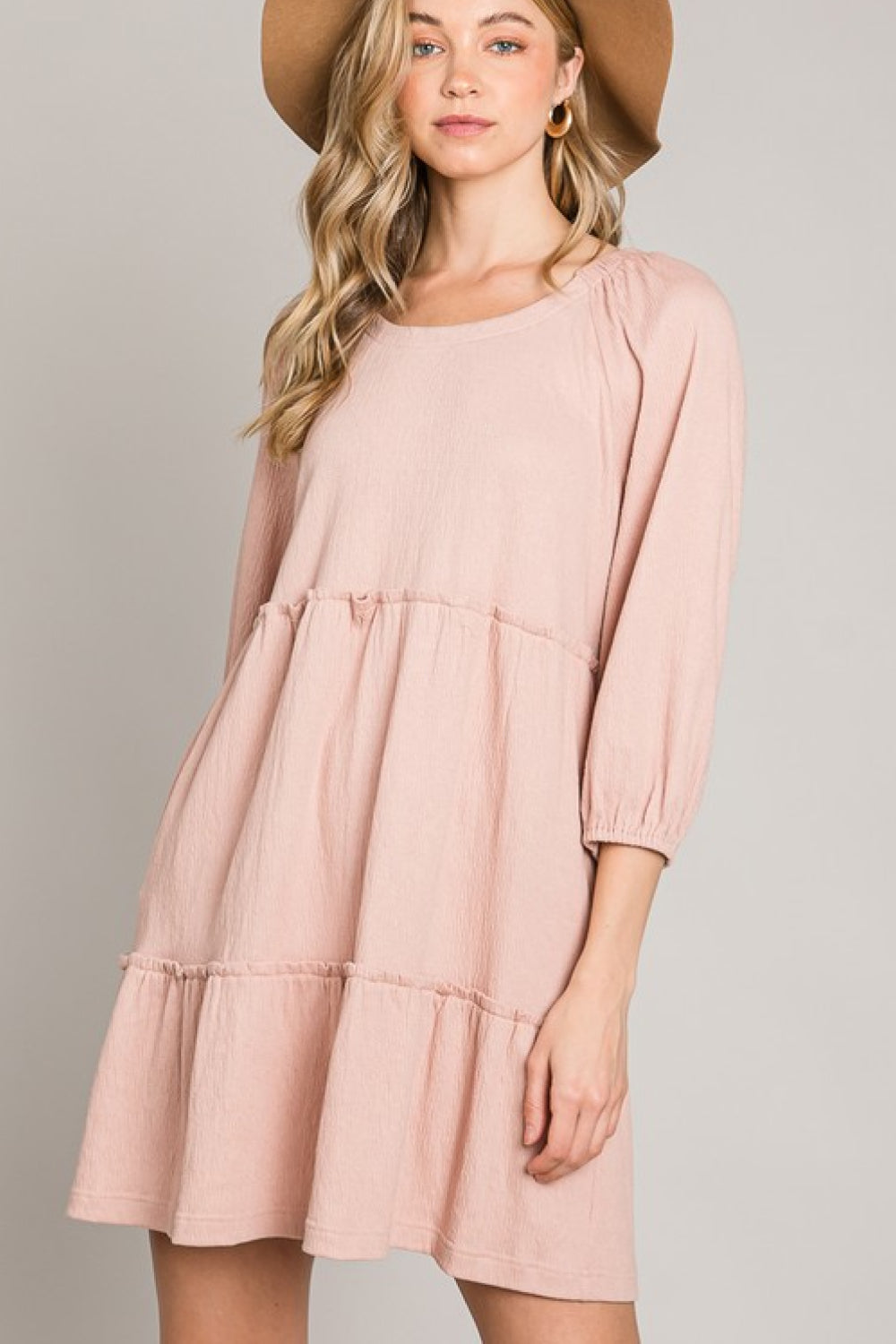 A stylish Tiered Tie-Back Dress featuring three-quarter sleeves, a low-back tie detail, and a tiered A-line design, perfect for casual or date night.