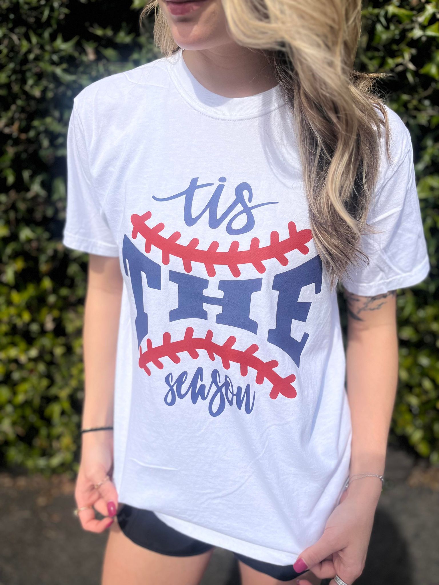 A stylish unisex baseball tee featuring a cute design, made from 100% cotton, perfect for baseball fans.