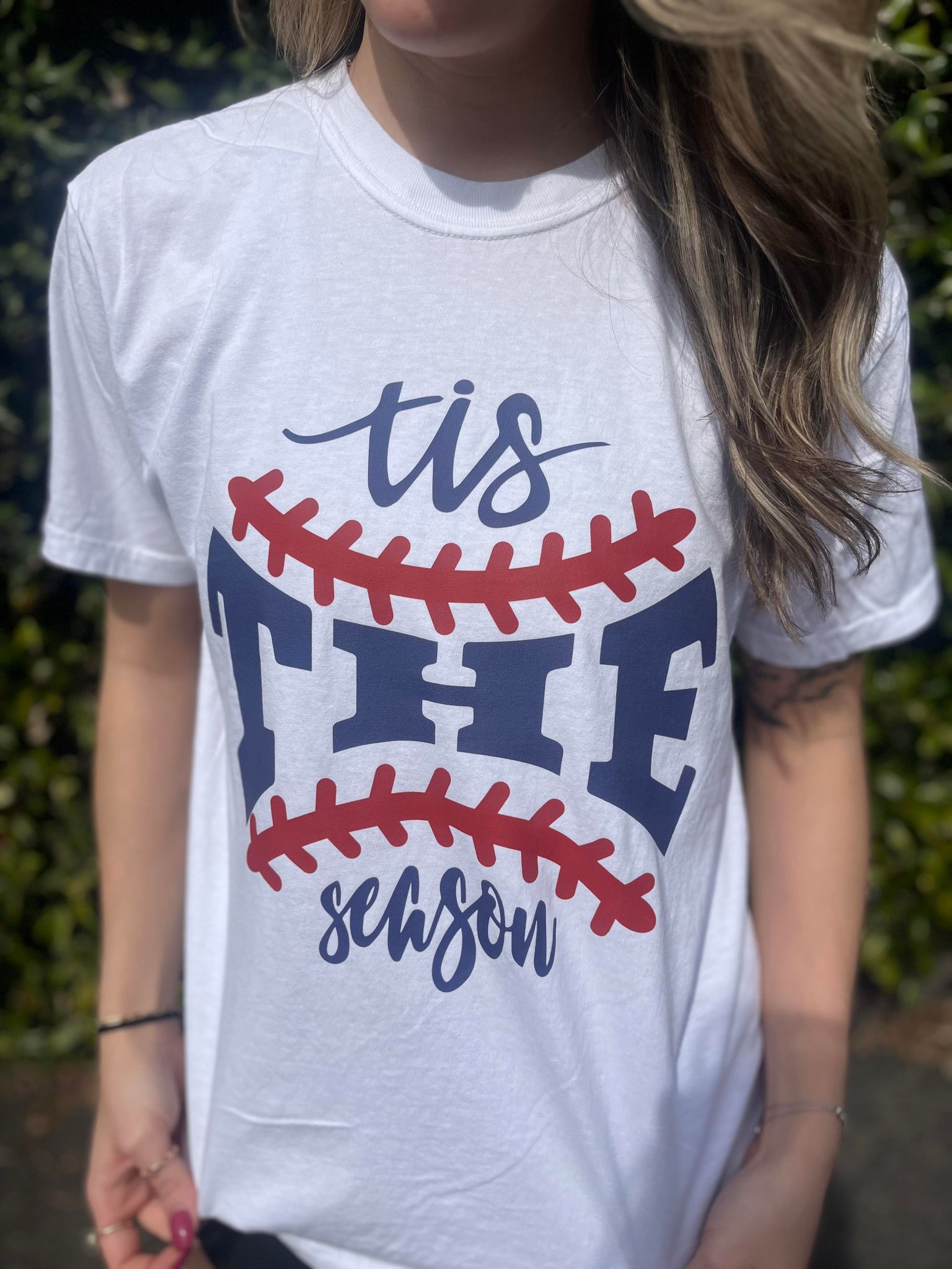 A stylish unisex baseball tee featuring a cute design, made from 100% cotton, perfect for baseball fans.