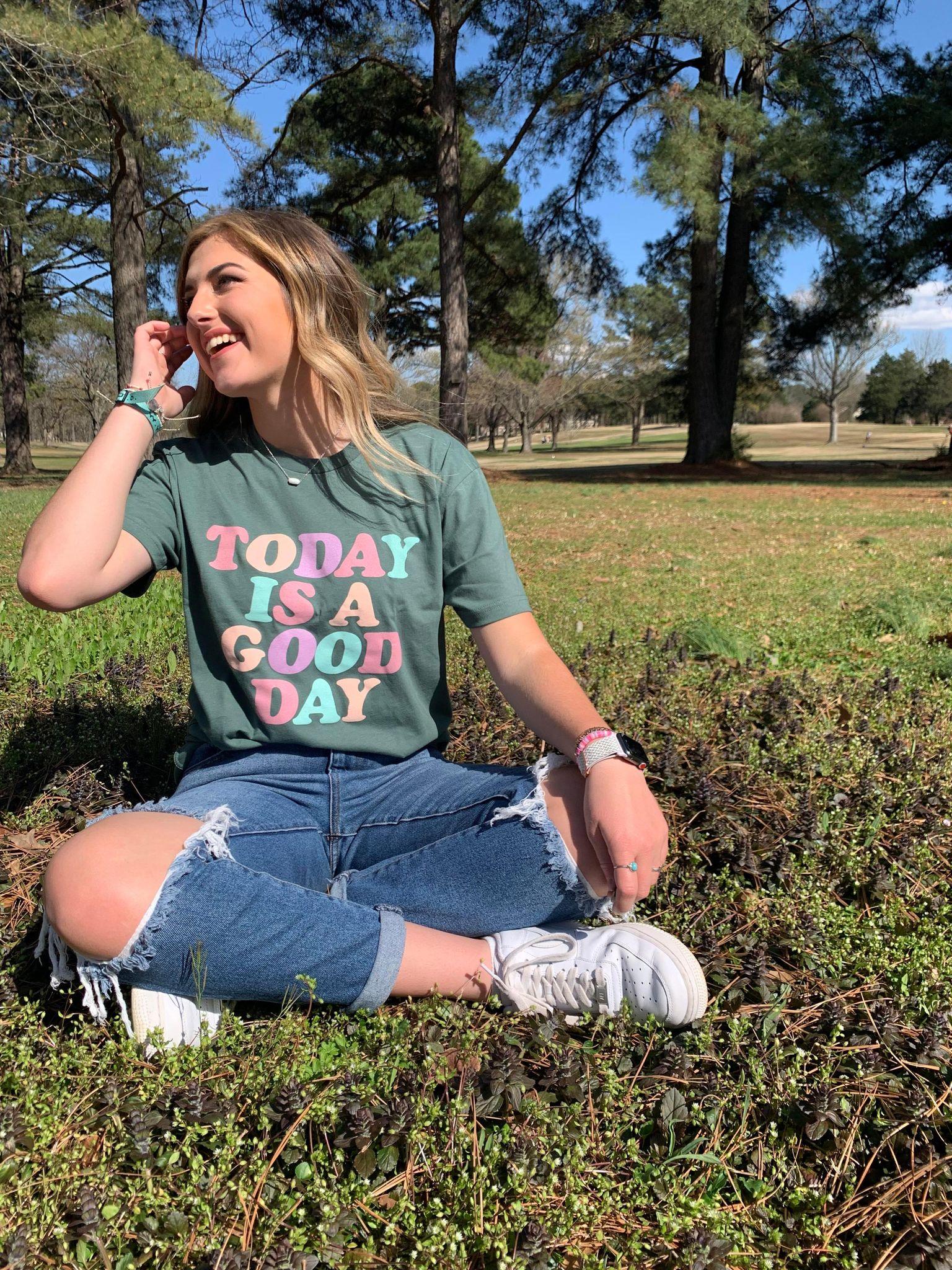 A colorful unisex tee with the phrase 'Today Is A Good Day' printed on it, showcasing a vibrant design.