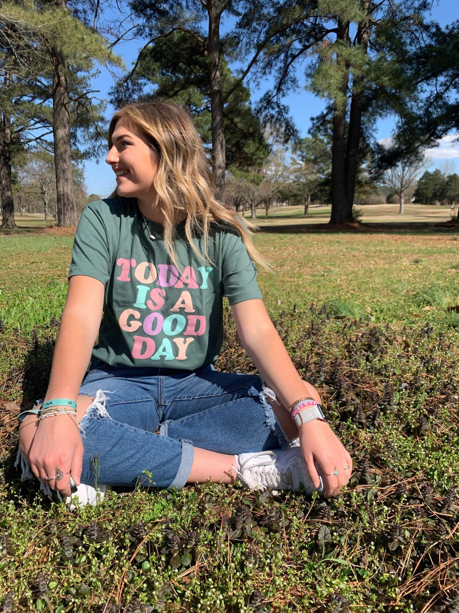 A colorful unisex tee with the phrase 'Today Is A Good Day' printed on it, showcasing a vibrant design.