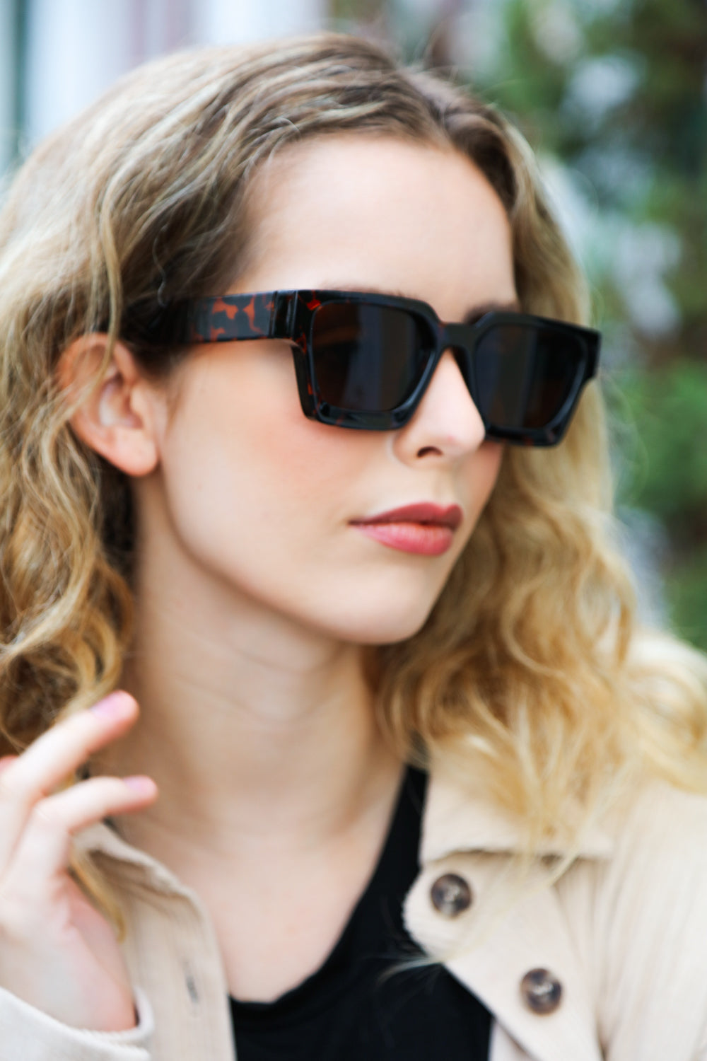 A pair of stylish tortoise shell thick frame rectangle sunglasses with brown tinted lenses, featuring a keyhole nose bridge.