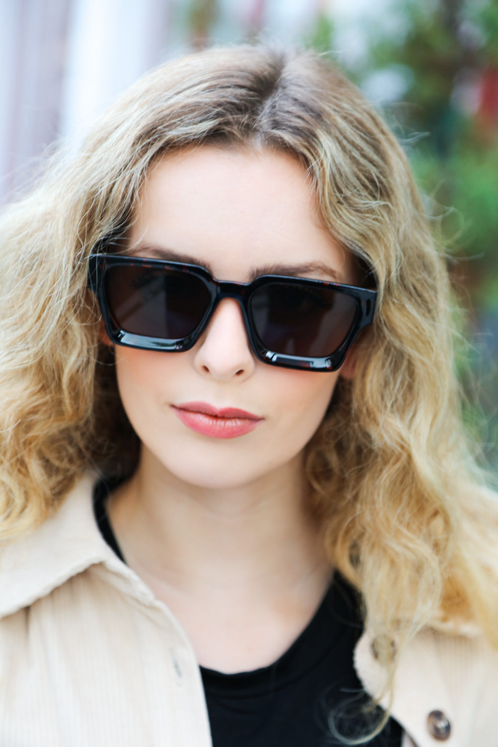 A pair of stylish tortoise shell thick frame rectangle sunglasses with brown tinted lenses, featuring a keyhole nose bridge.