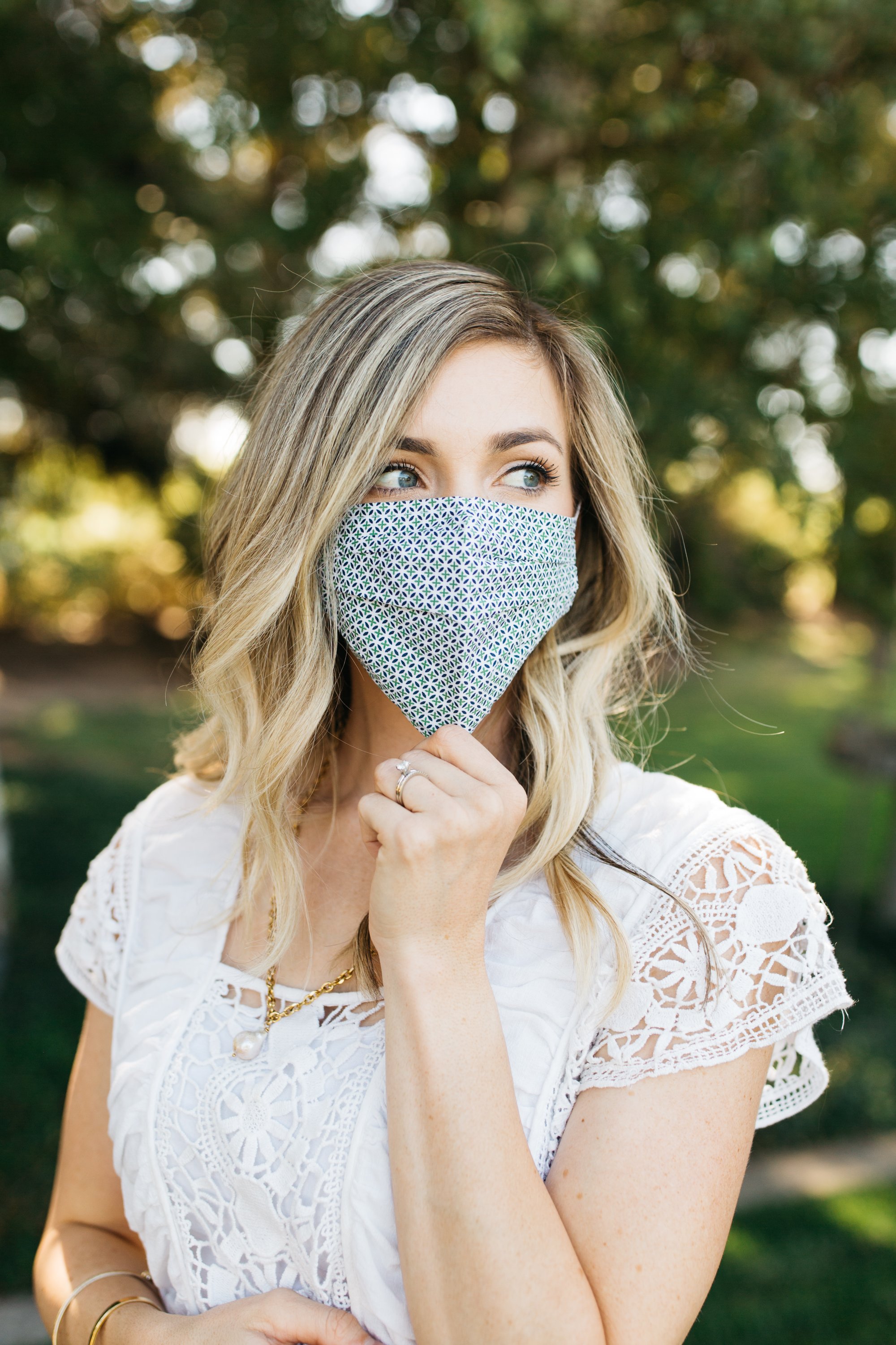 Tory Green Face Mask made of 100% cotton, featuring pleats for comfort and a pocket for filters, suitable for most adults.