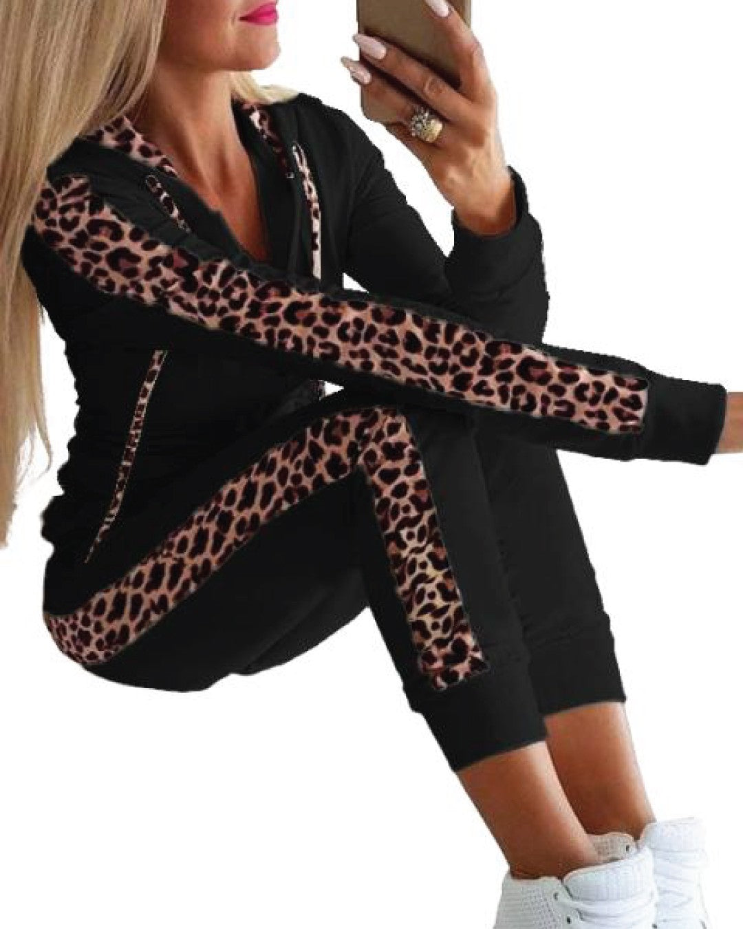 Black tracksuit with tiger print, featuring a hooded top and long pants with elastic waist and cuffs.