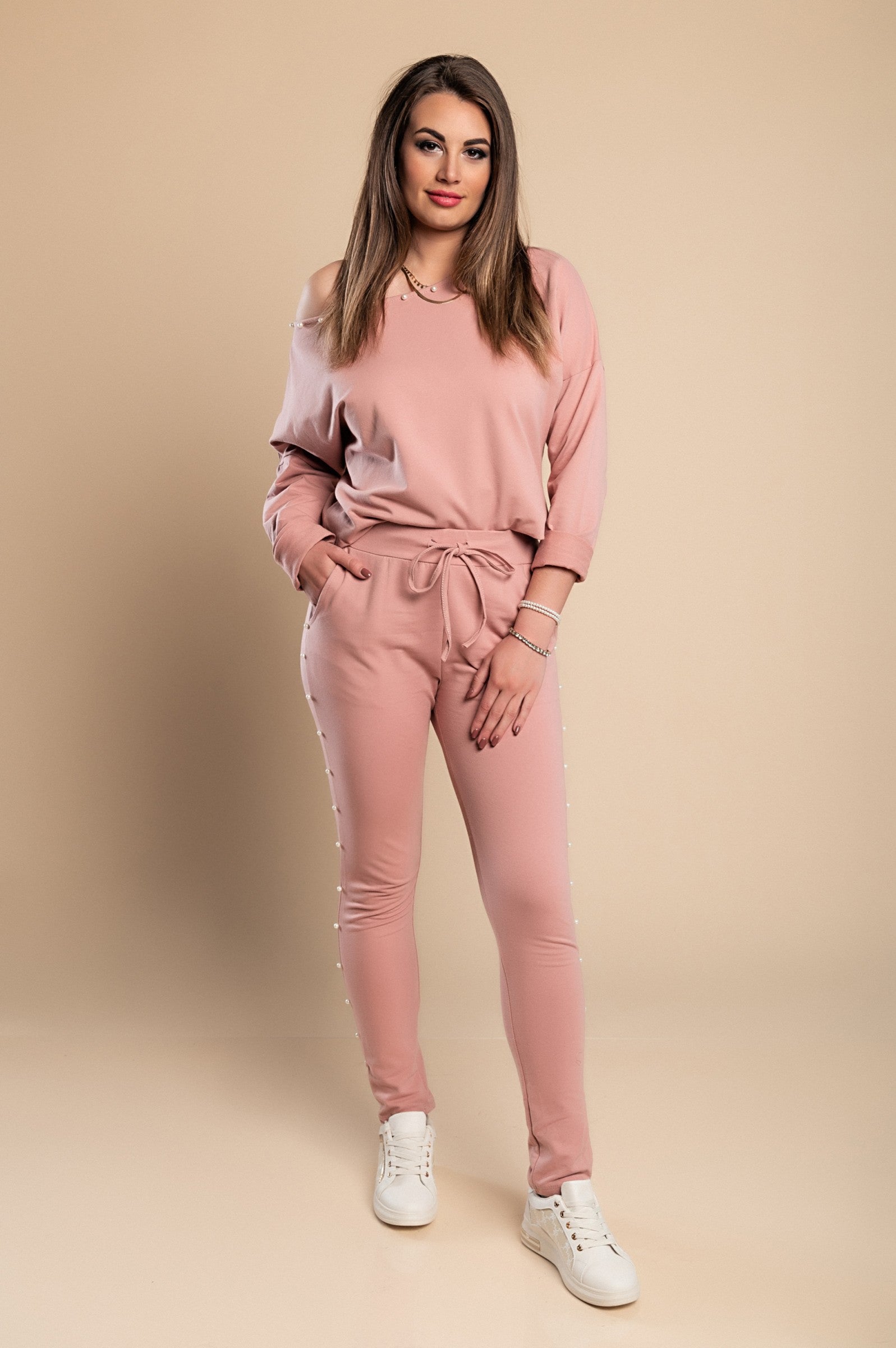 Kyla Tracksuit Set in pink featuring pearl details on the sweatshirt and pants, made of high-quality cotton for comfort.