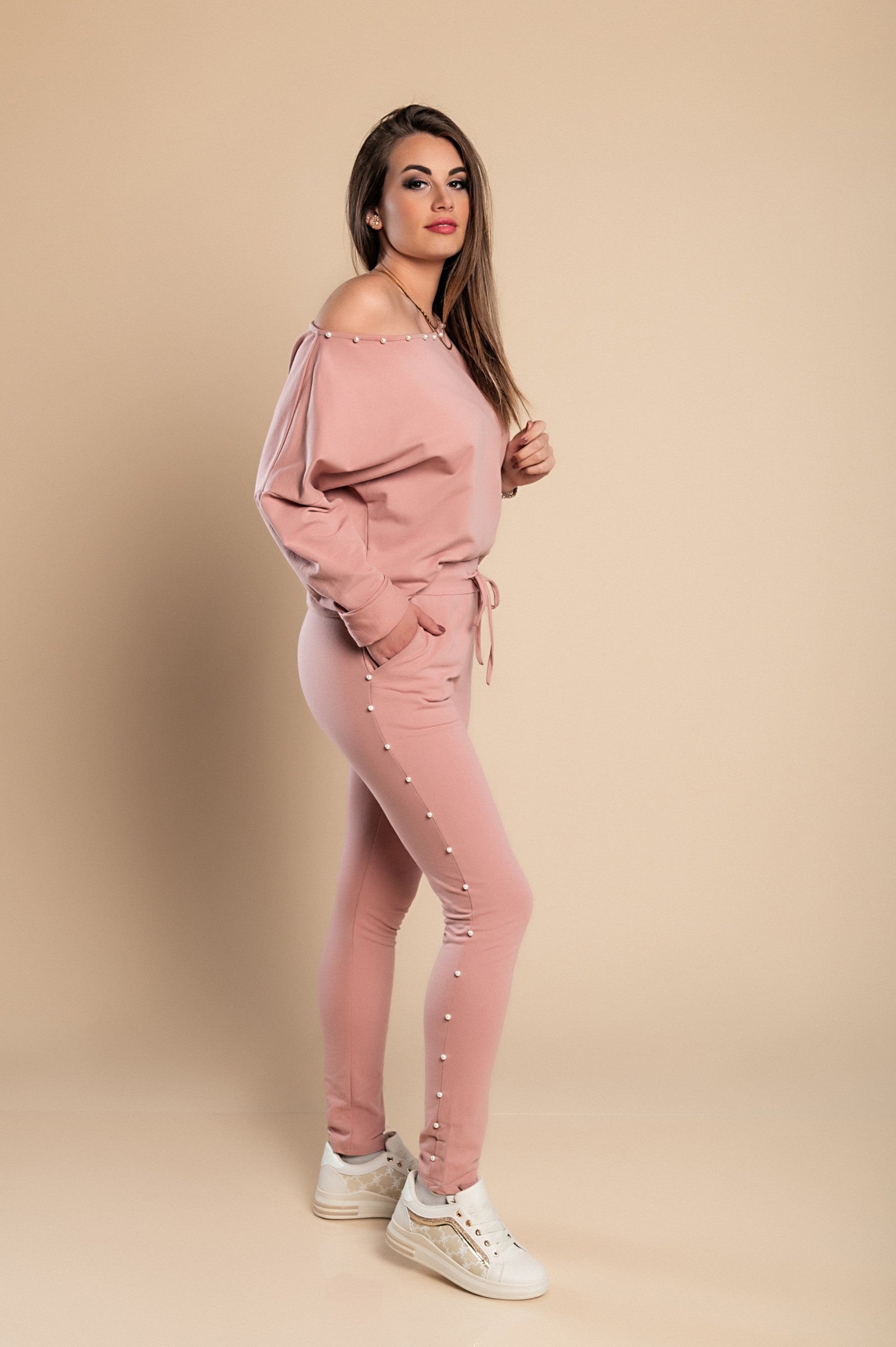 Kyla Tracksuit Set in pink featuring pearl details on the sweatshirt and pants, made of high-quality cotton for comfort.