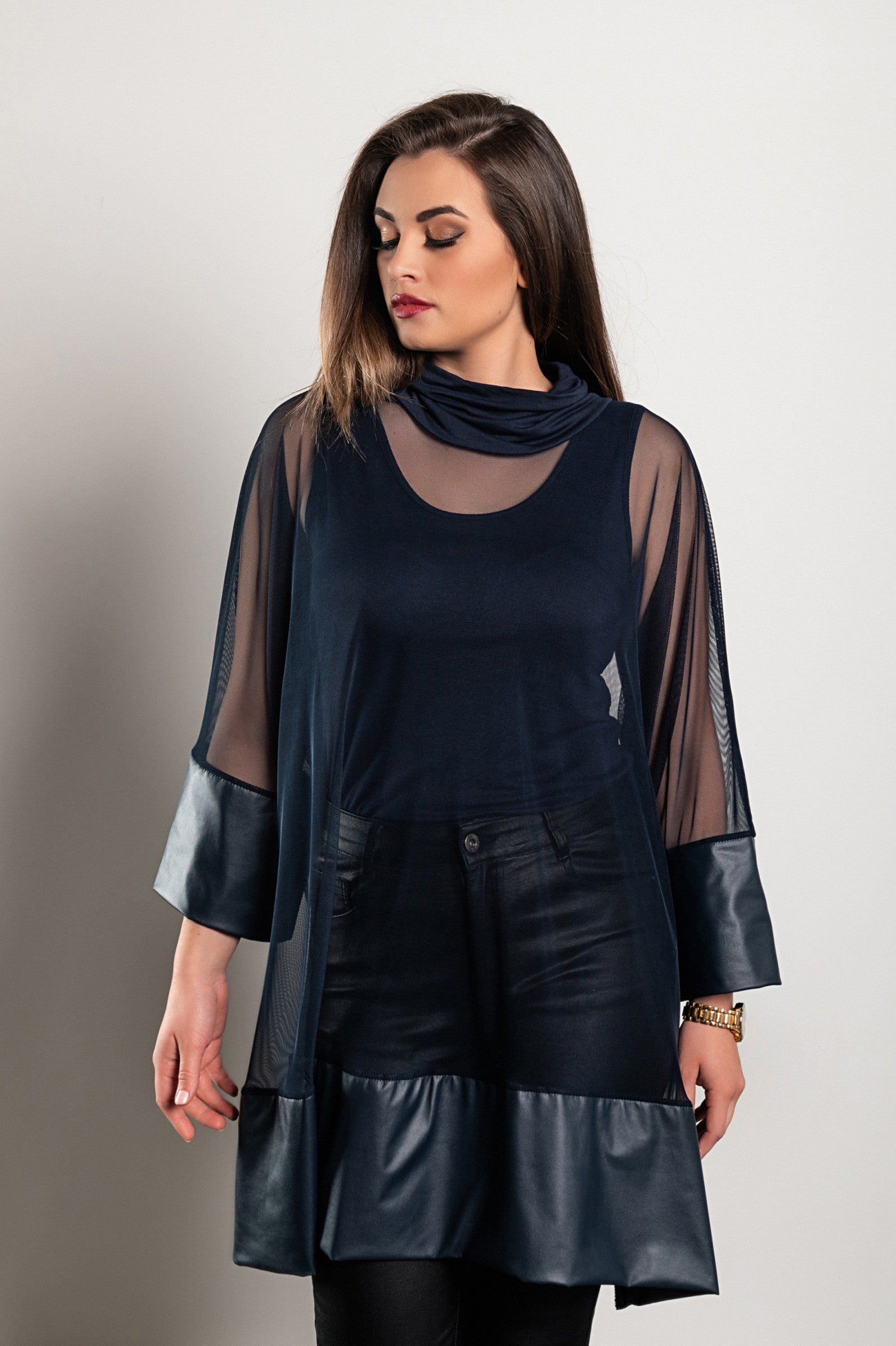 A stylish blue transparent tunic featuring artificial leather accents, high neckline, and faux fur sleeves, perfect for various occasions.