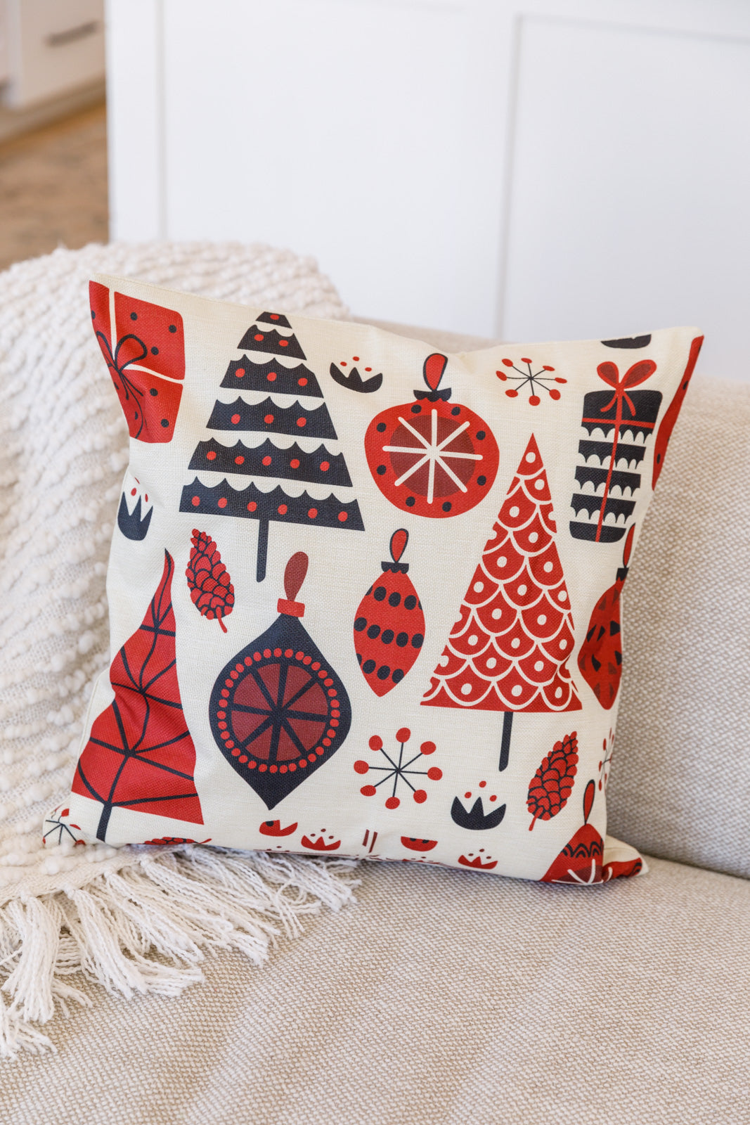 Trees & Ornaments Pillow Case featuring red and black holiday designs with trees, ornaments, and pinecones on a linen-like fabric.