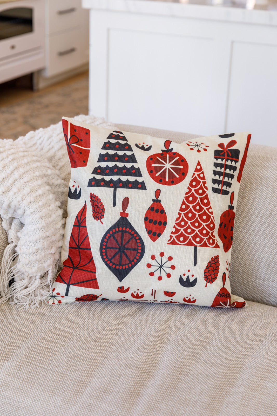 Trees & Ornaments Pillow Case featuring red and black holiday designs with trees, ornaments, and pinecones on a linen-like fabric.