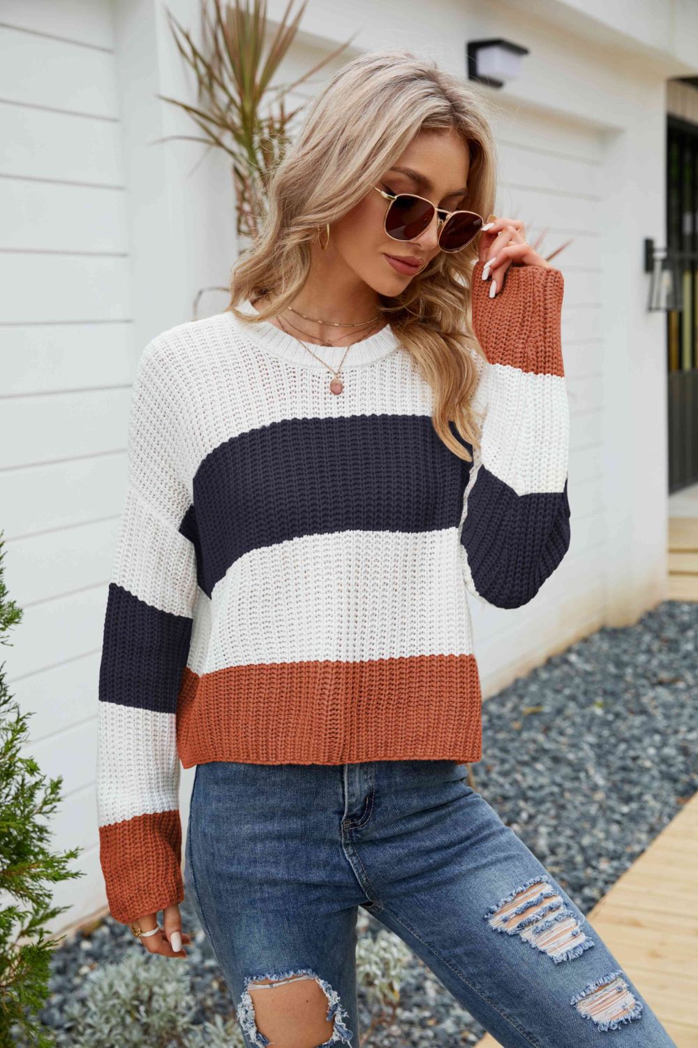 Tricolor color block round neck sweater with dropped shoulders, featuring a chic striped pattern, perfect for casual wear.