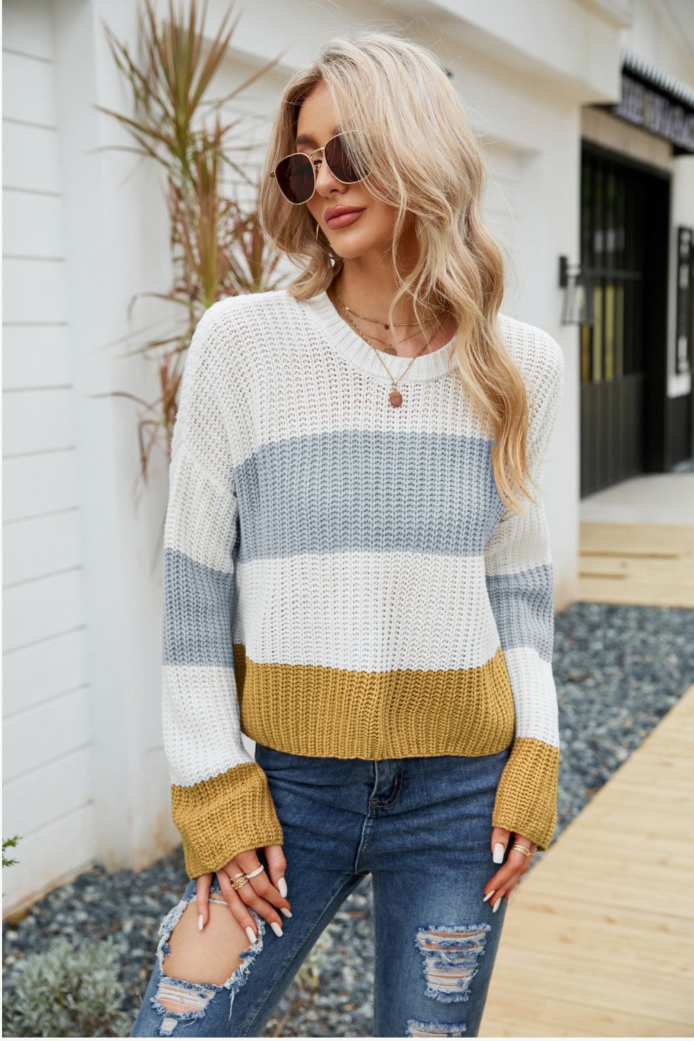 Tricolor color block round neck sweater with dropped shoulders, featuring a chic striped pattern, perfect for casual wear.