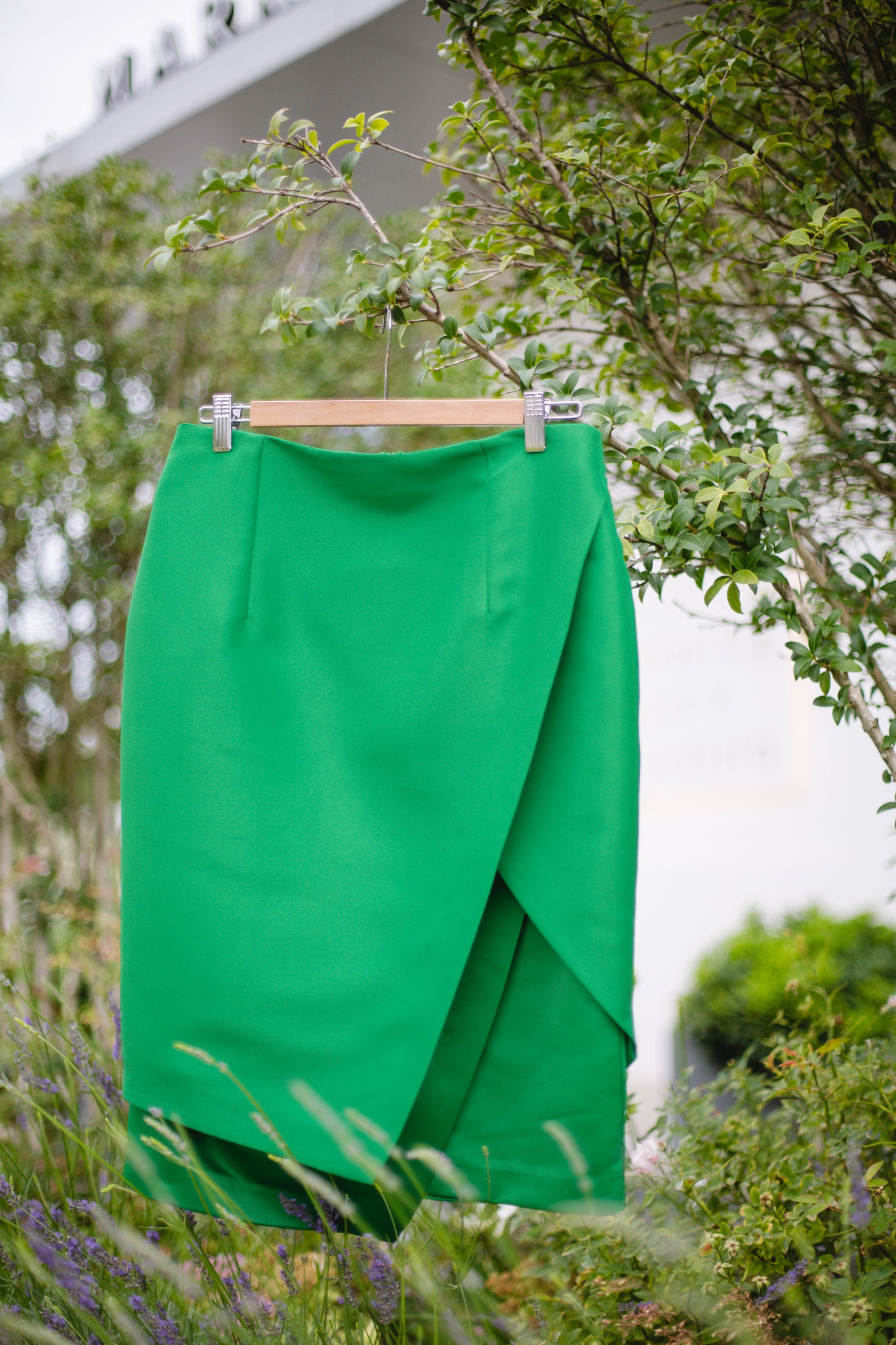 A stylish Tropical Statement Skirt featuring a wrap design with two textured fabrics, perfect for various occasions.