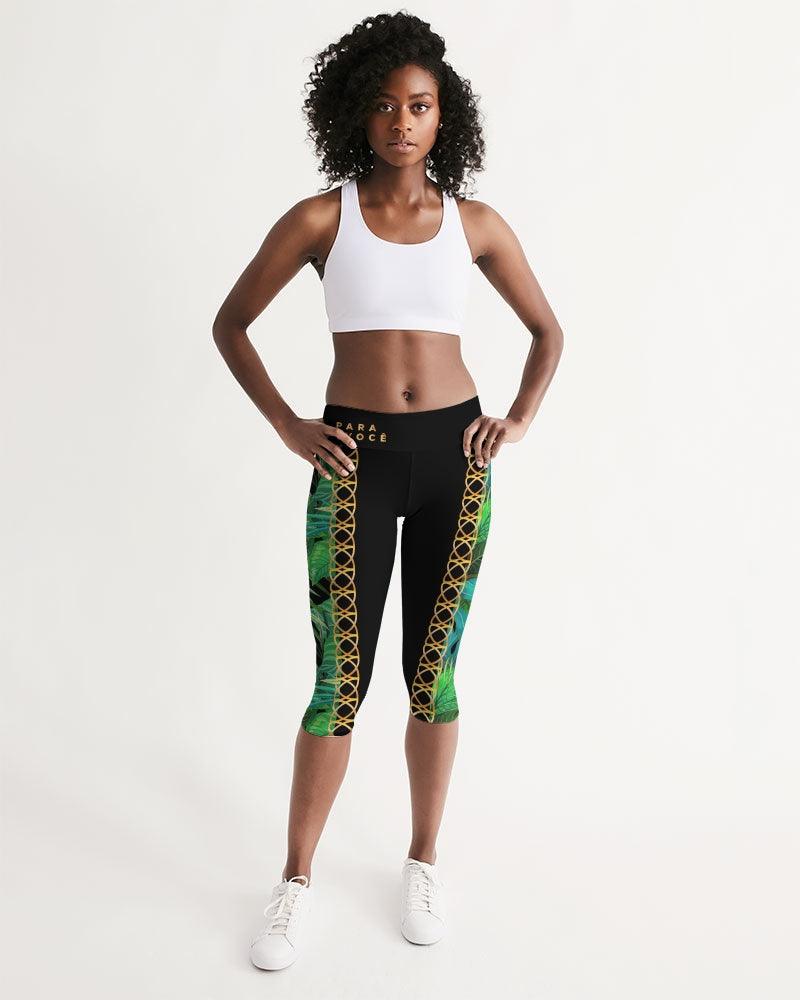 TROPICS OF OZ - INTO THE WILD Women's Mid-Rise Capri featuring a vibrant animal print on a clean white background, designed for comfort and style.