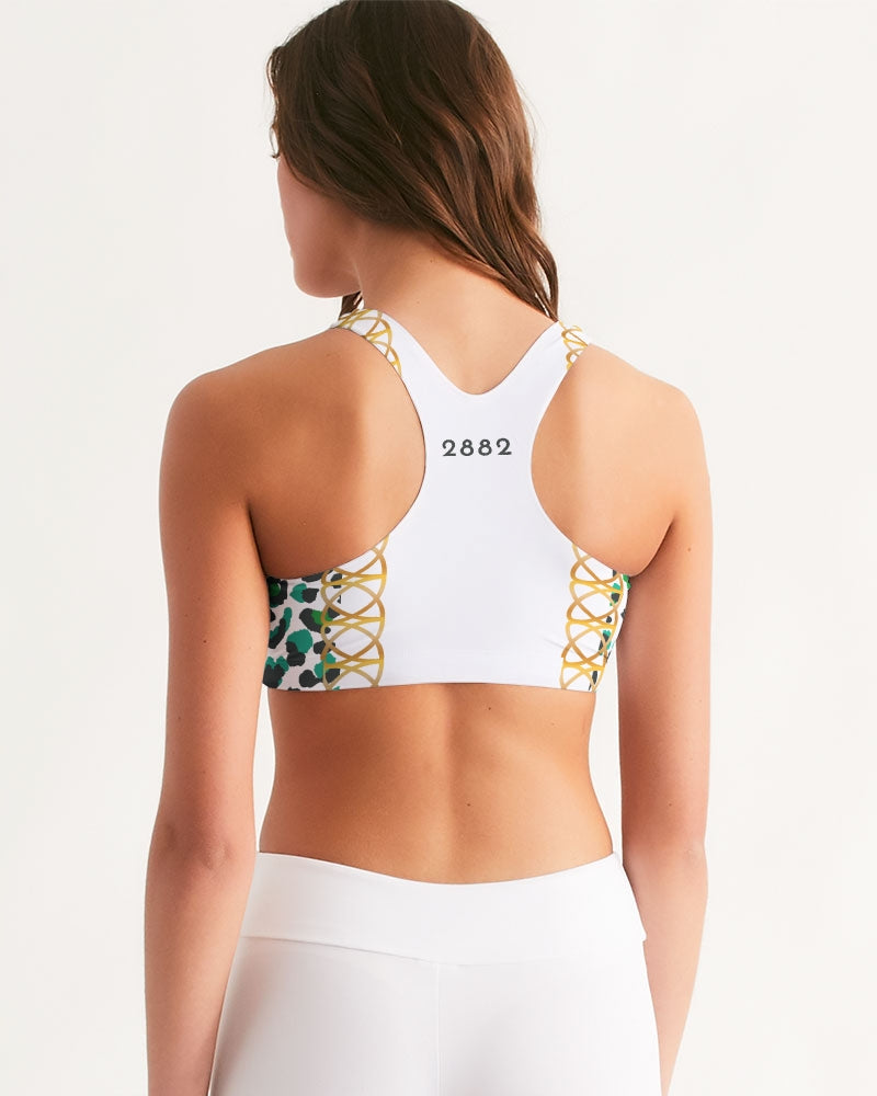 TROPICS OF OZ - INTO THE WILD Women's Seamless Sports Bra featuring a vibrant animal print on a clean white background.