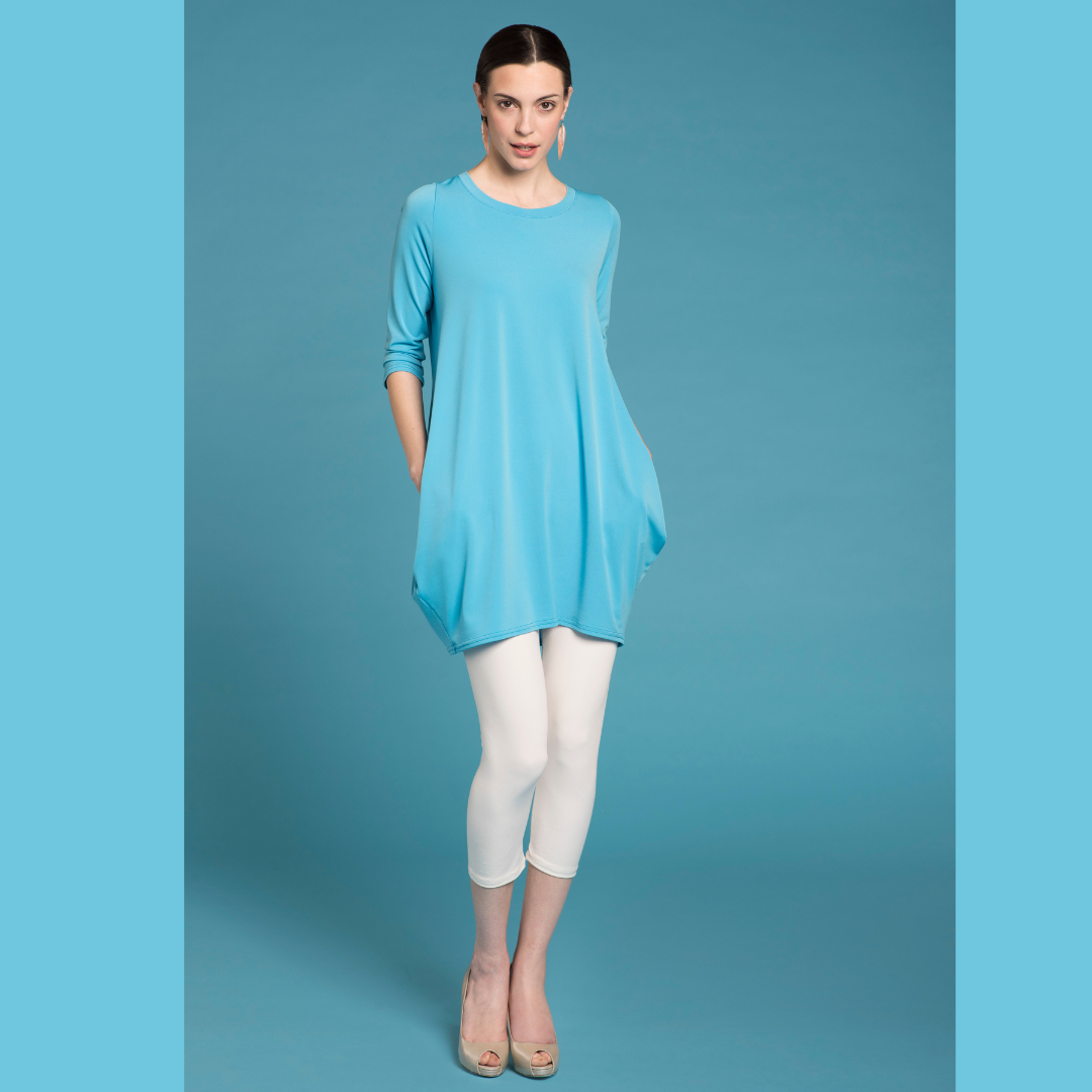 A stylish Tunic Dress featuring a scoop neck, 3/4 sleeves, and convenient side pockets, perfect for versatile wear.